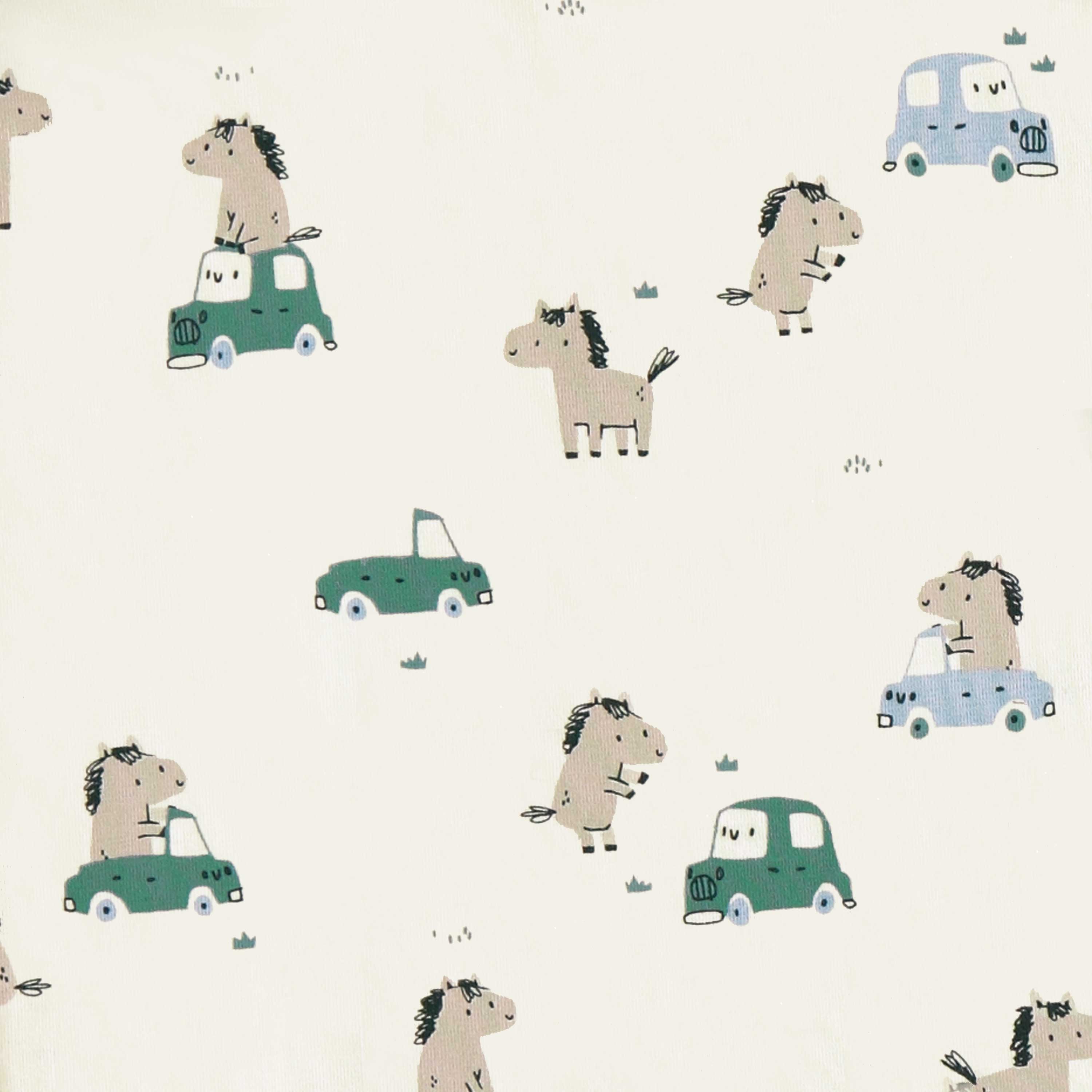 Détail du pyjama une pièce crème à motifs de chevaux, naissance