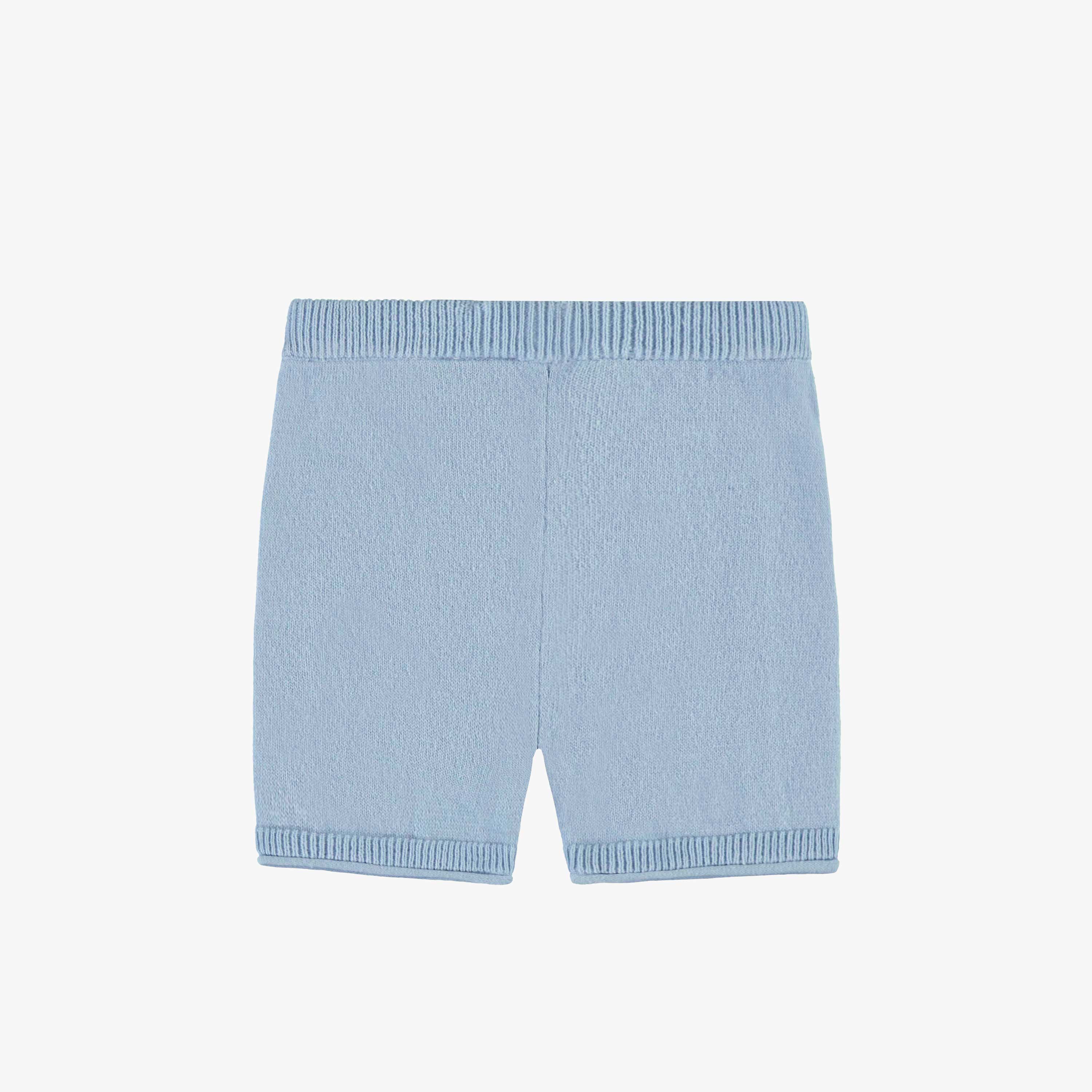 Dos du short bleu pâle en tricot, naissance