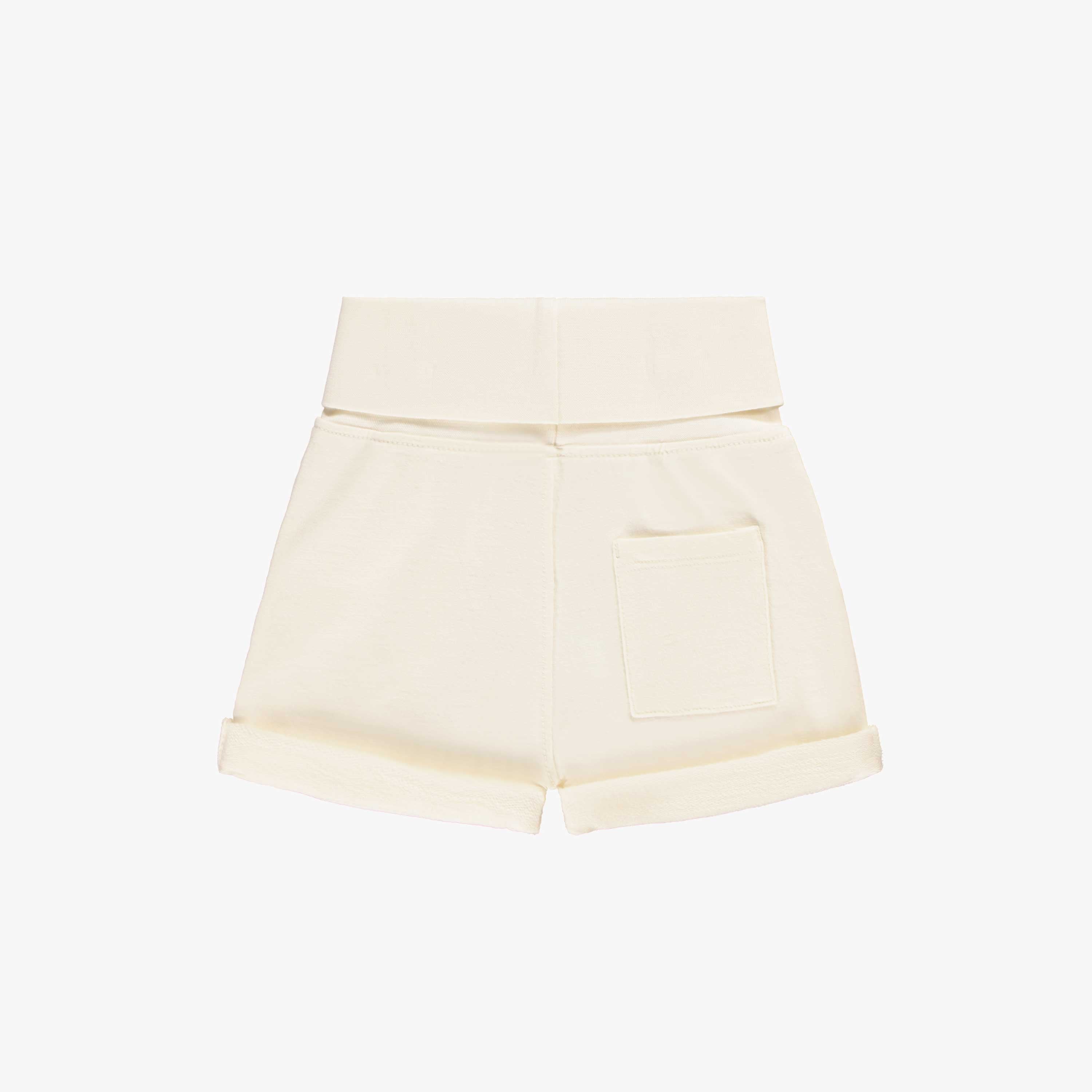 Dos du short crème en doux coton français, naissance