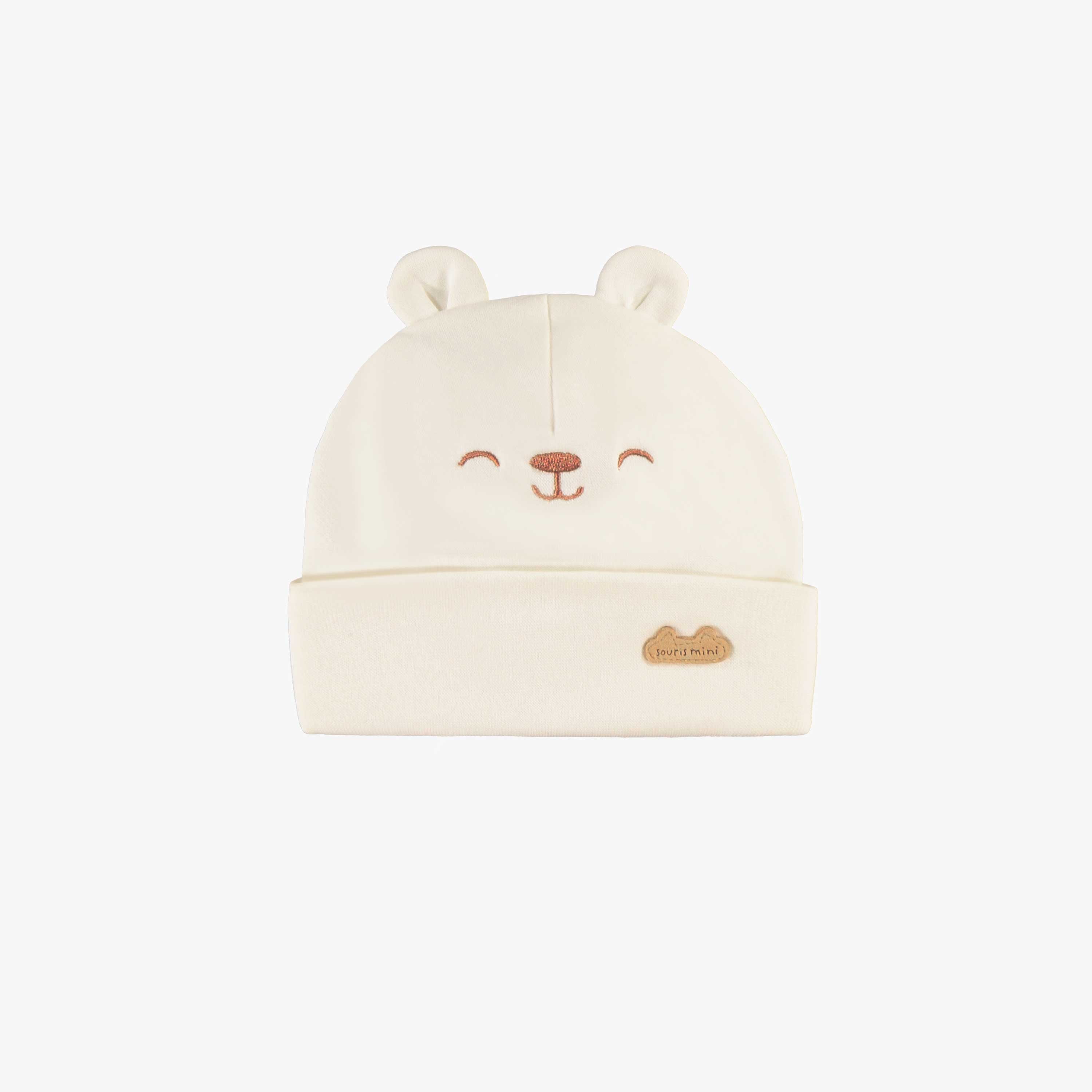 Bonnet crème avec oreilles, naissance
