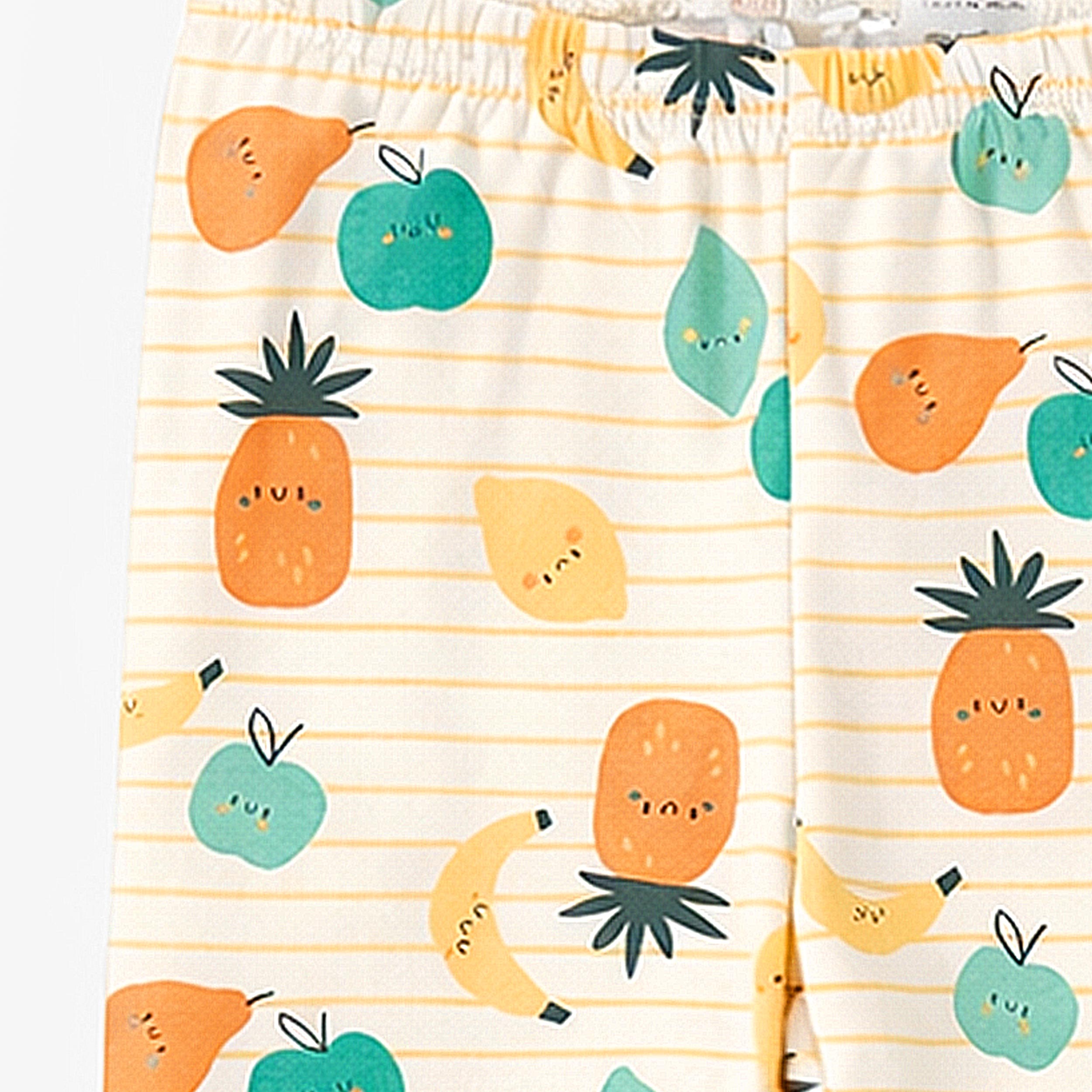 Zoom du pantalon du pyjama deux pièces crème à rayures et motifs de fruits, enfant