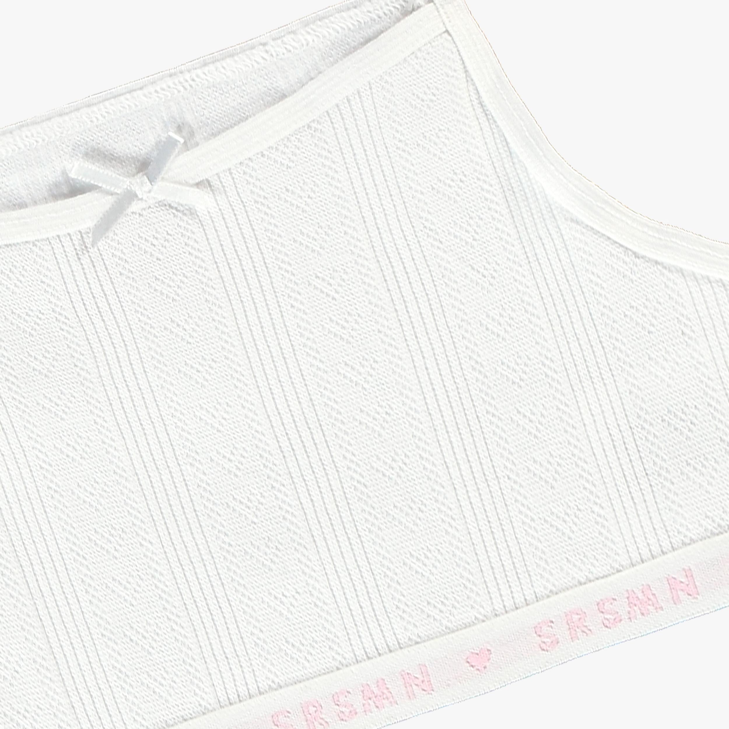 Zoom détails de la camisole courte blanche à motif pointelle, enfant