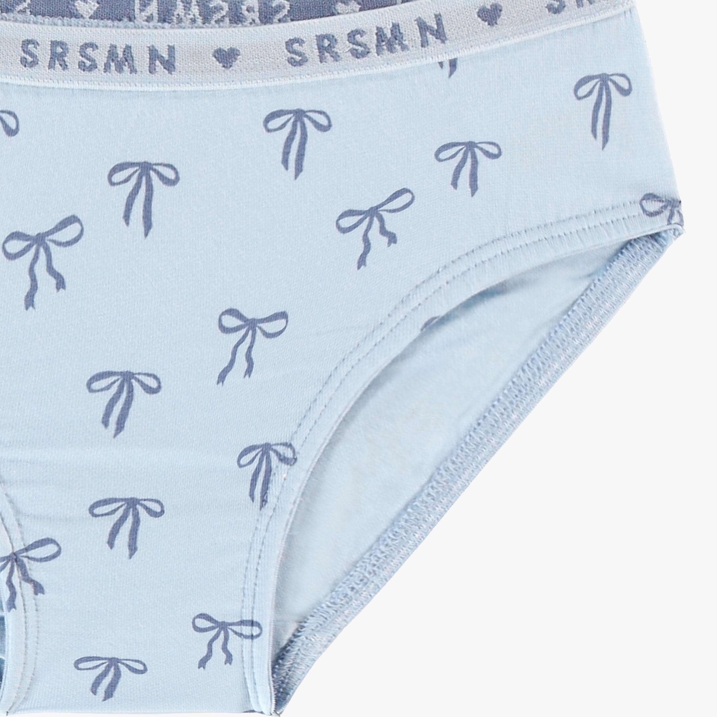 Zoom détails de la culotte bikini bleue à motifs de boucles, enfant
