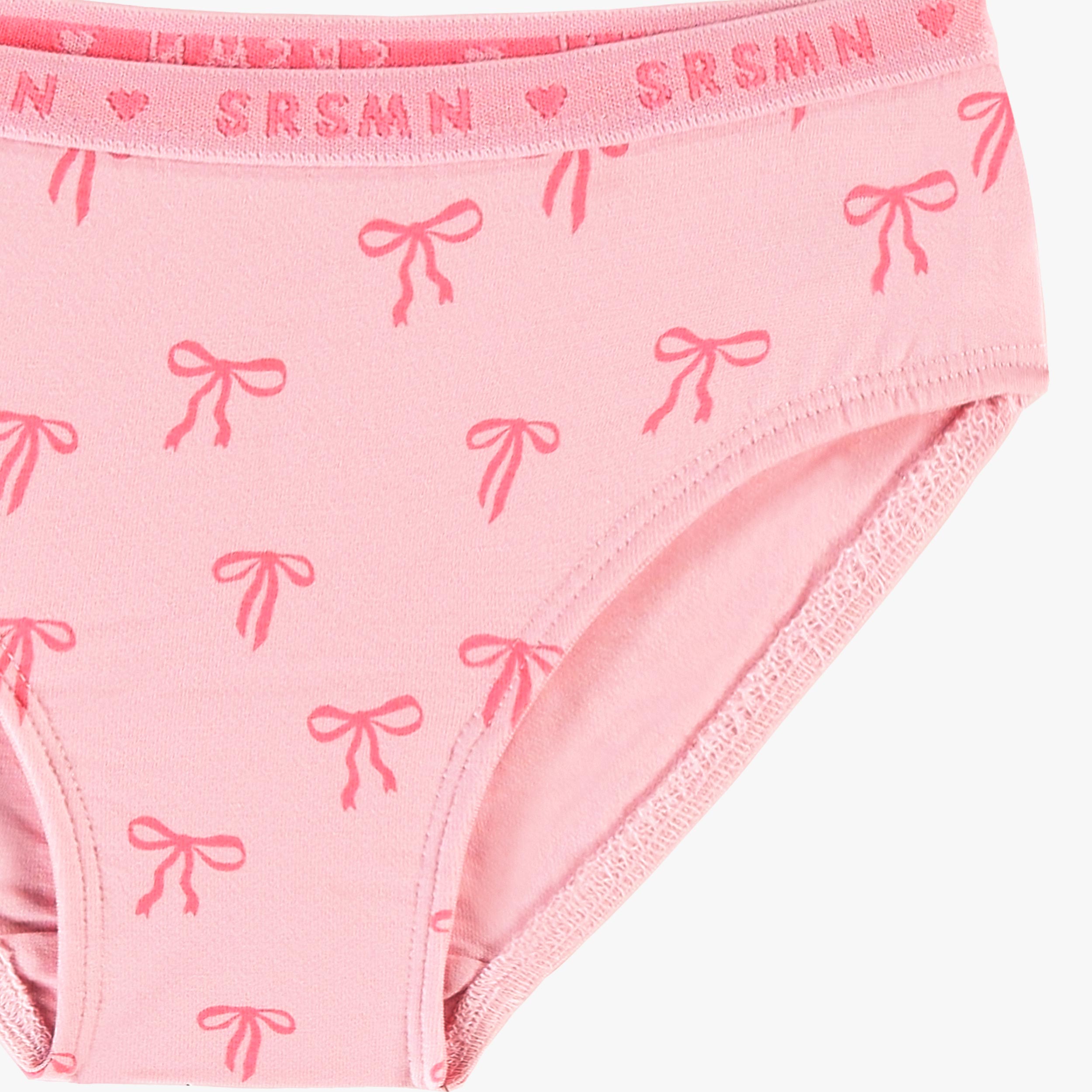 Zoom détails de la culotte bikini rose à motifs de boucles, enfant