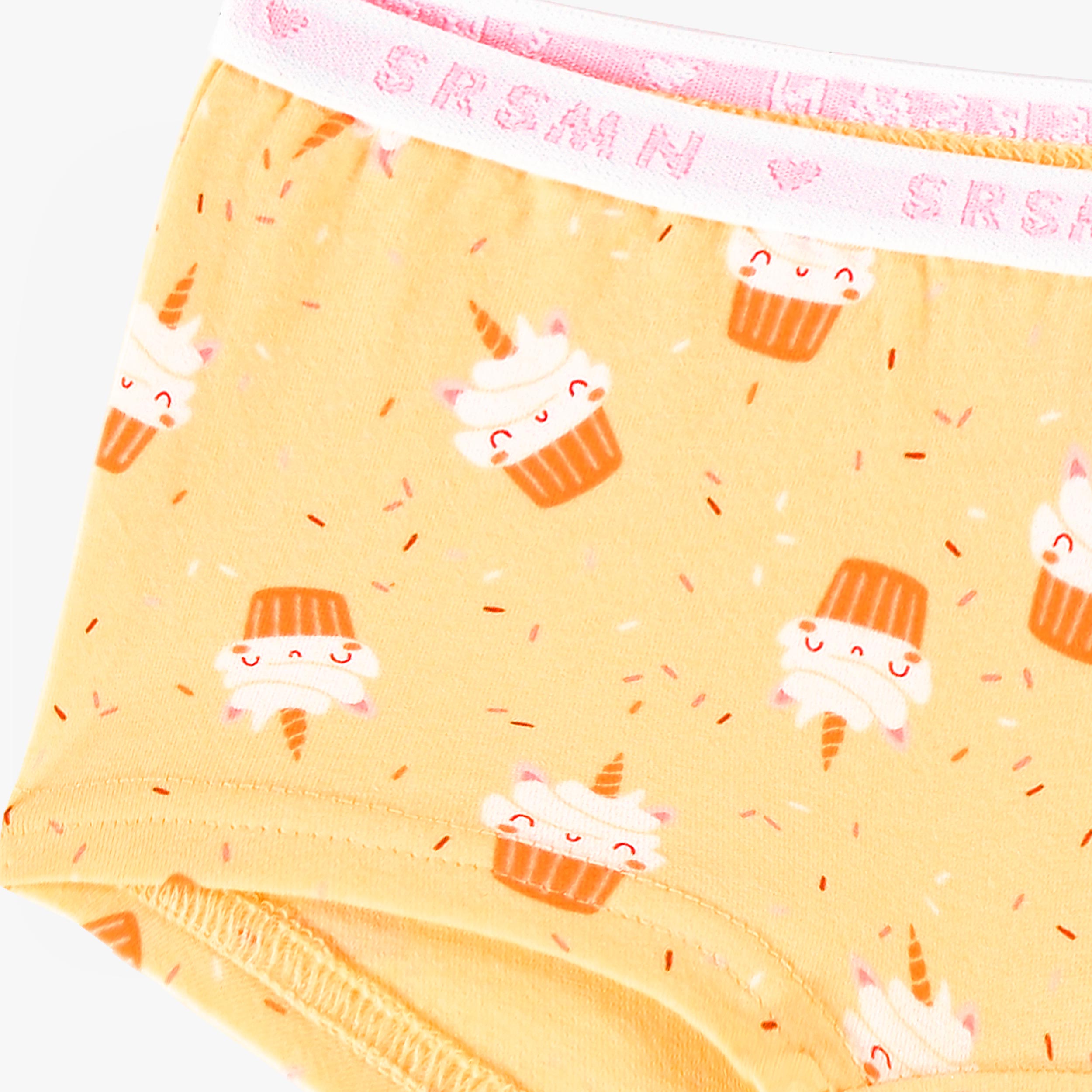 Zoom détails de la culotte garçonne jaune à motifs de petits gâteaux, enfant