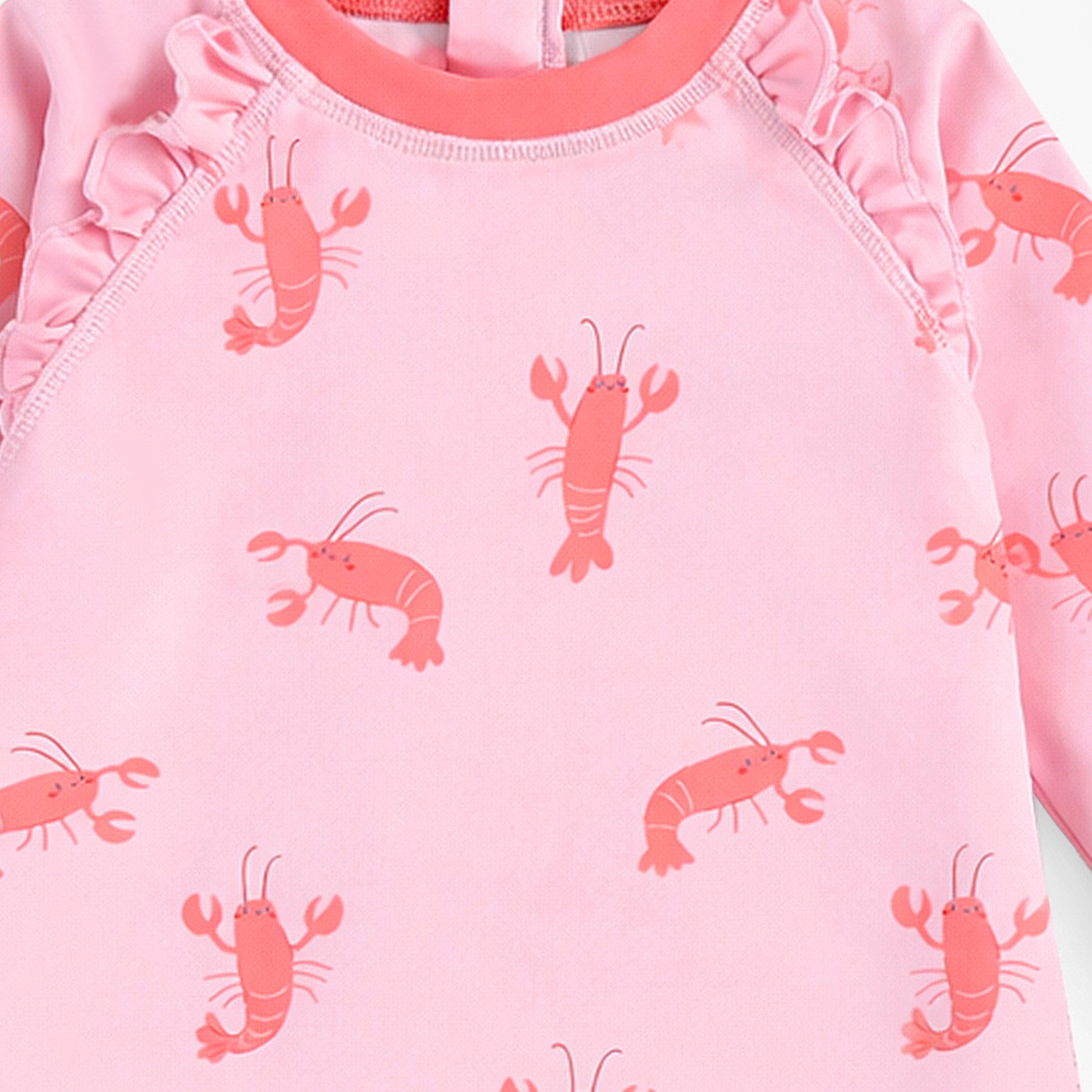 Zoom détails du maillot de bain une pièce rose à motifs de homards, bébé