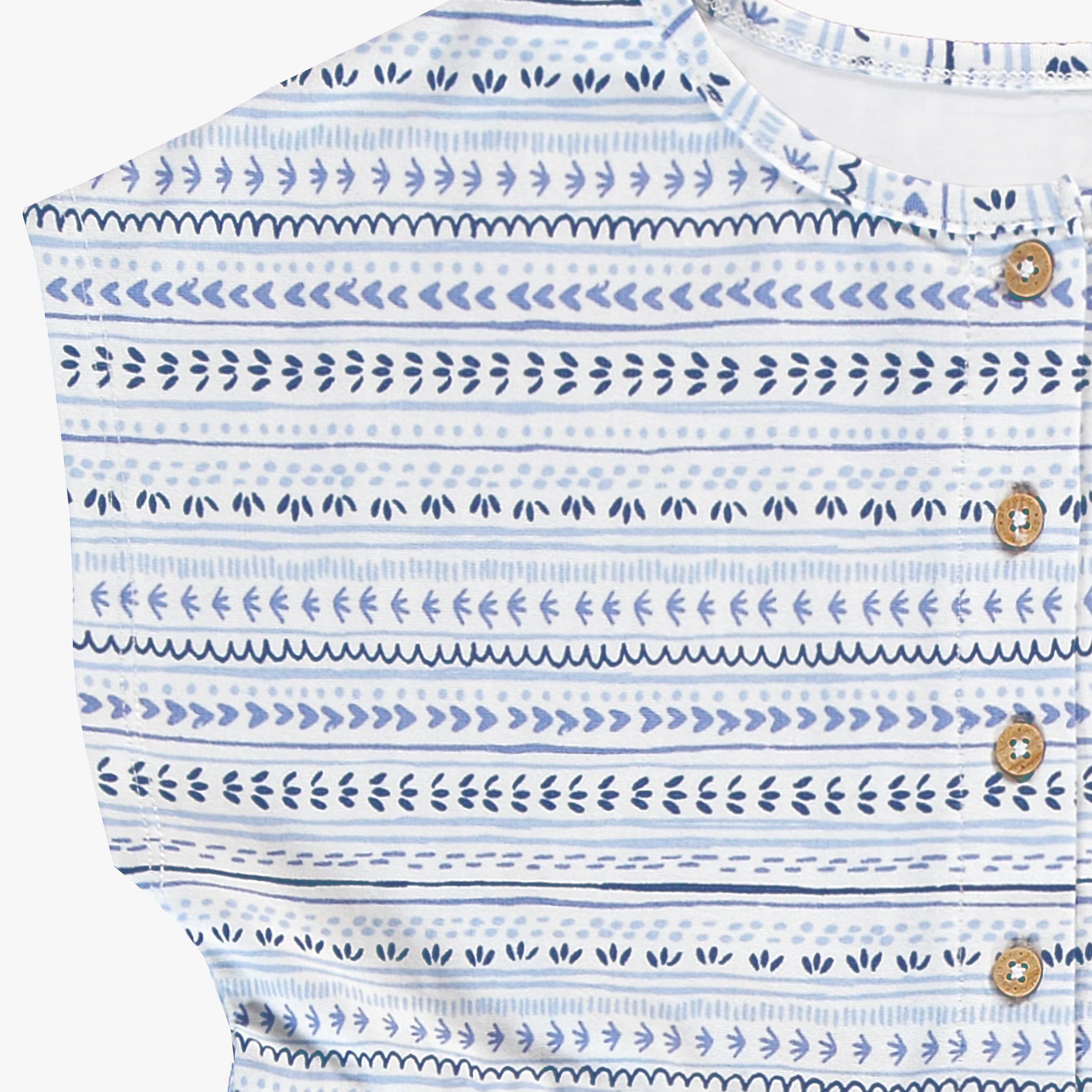 Zoom détails de la robe blanche et bleue à motifs, enfant