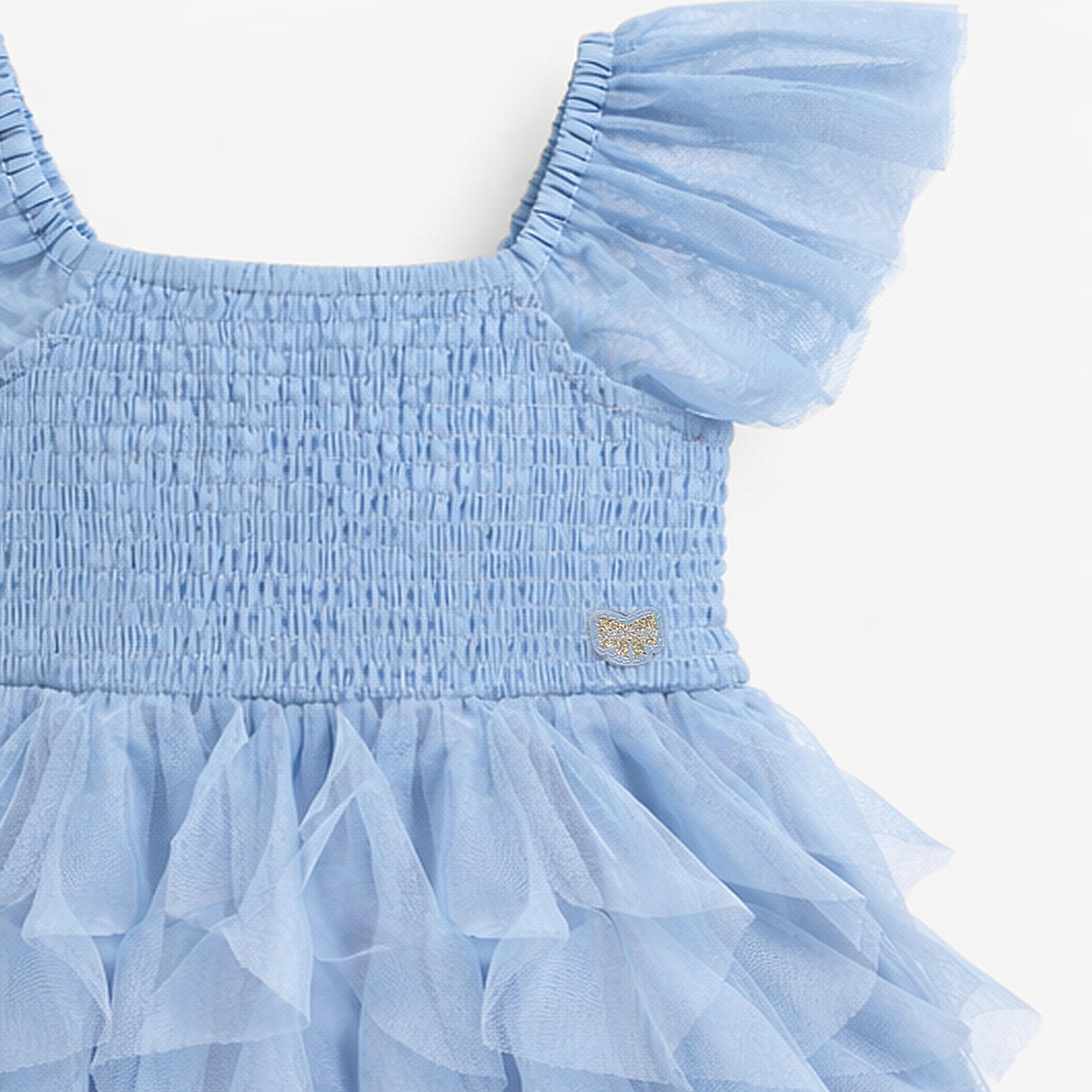 Zoom détails de la robe bleue en tulle souple, enfant
