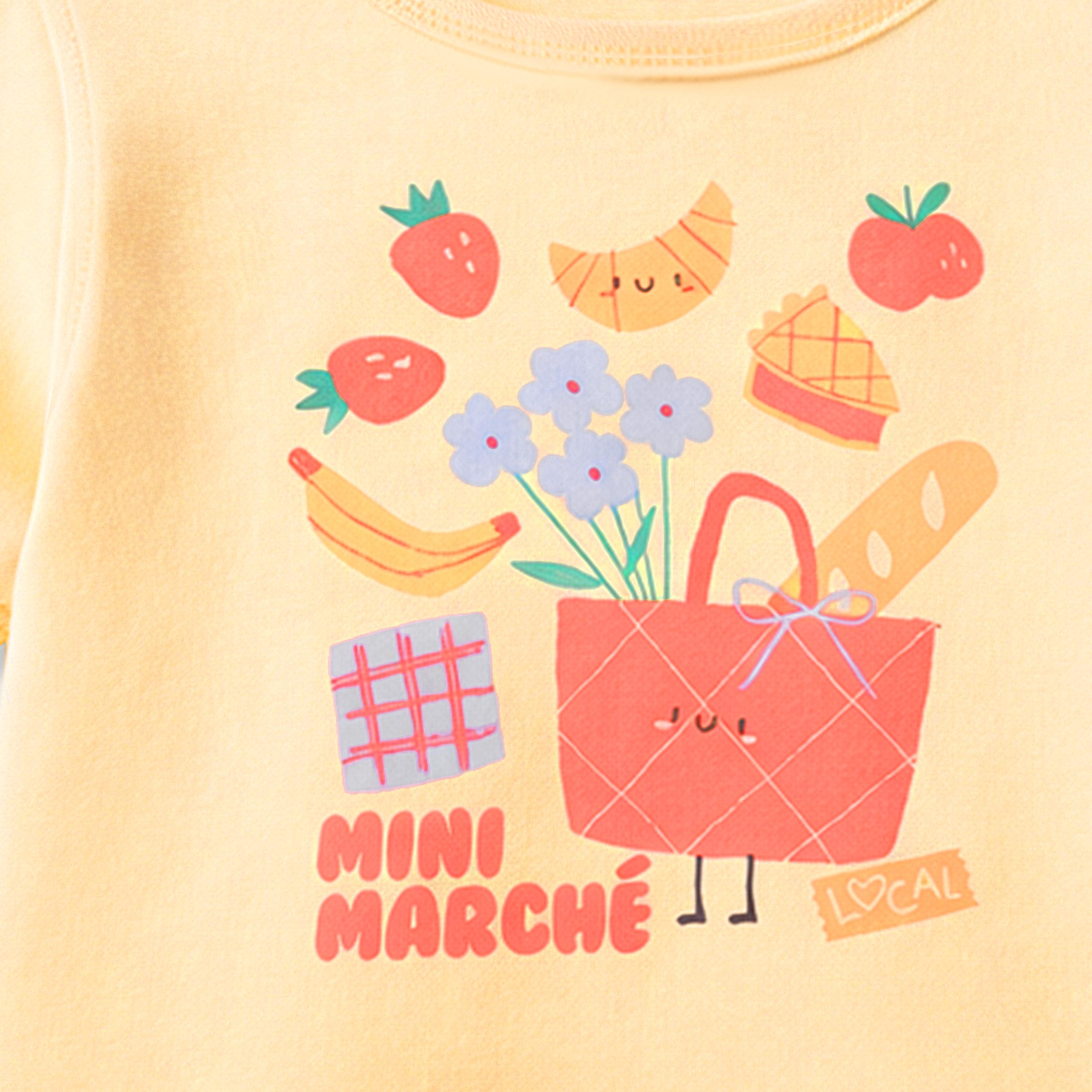 Zoom détails du t-shirt jaune avec illustration, enfant