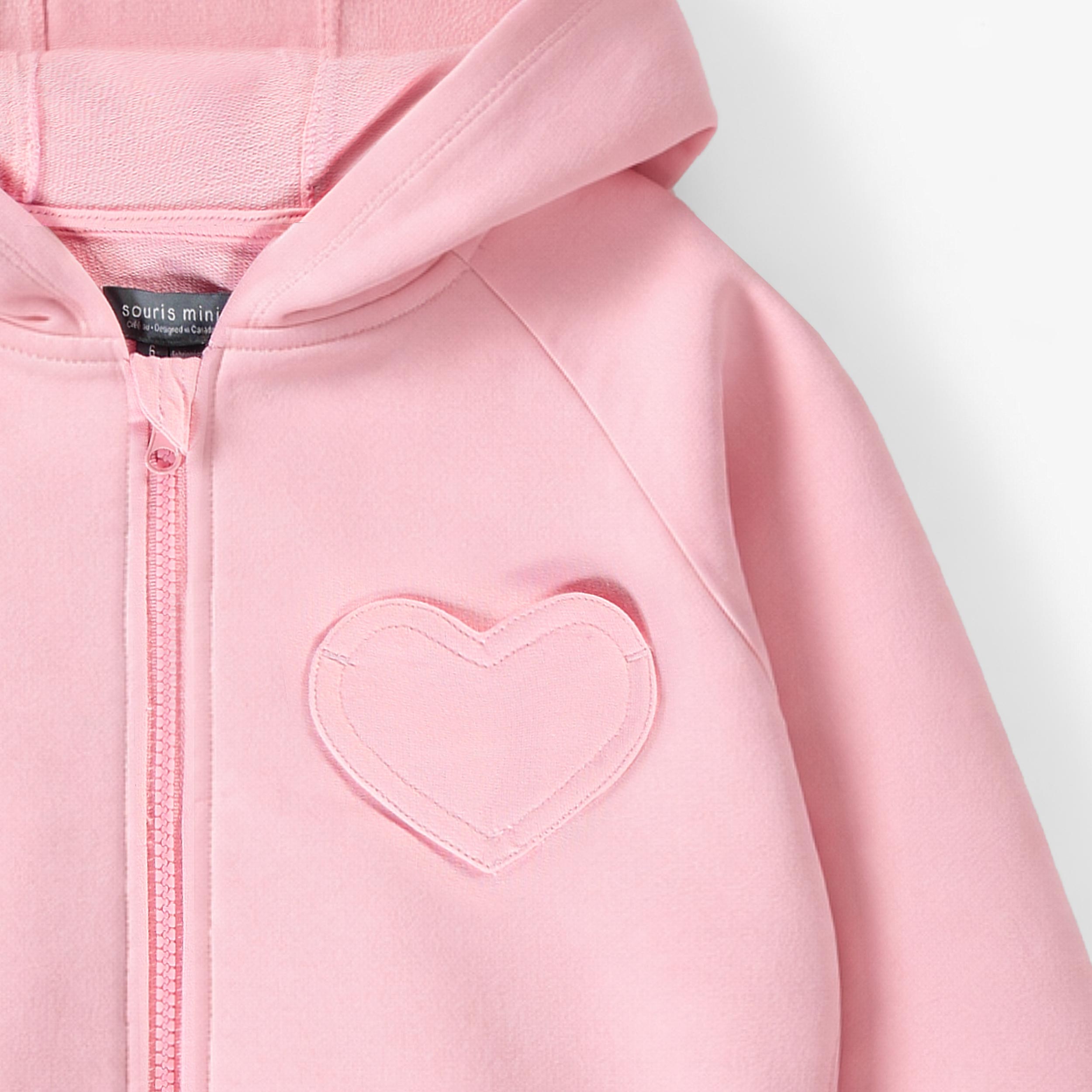 Zoom détails de la veste à capuchon rose, enfant