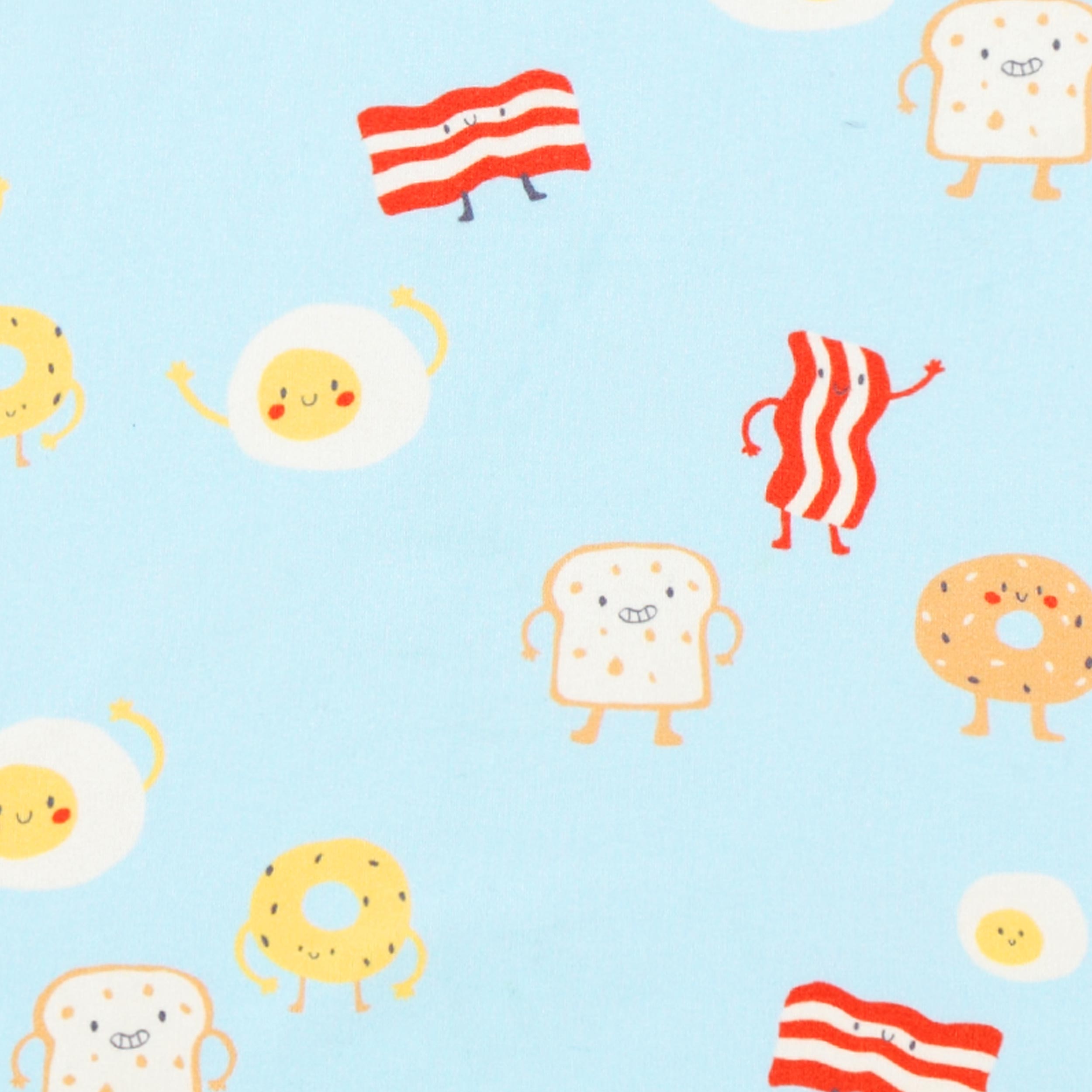 Zoom détails de motifs du pyjama deux pièces bleu à motifs de déjeuner, enfant