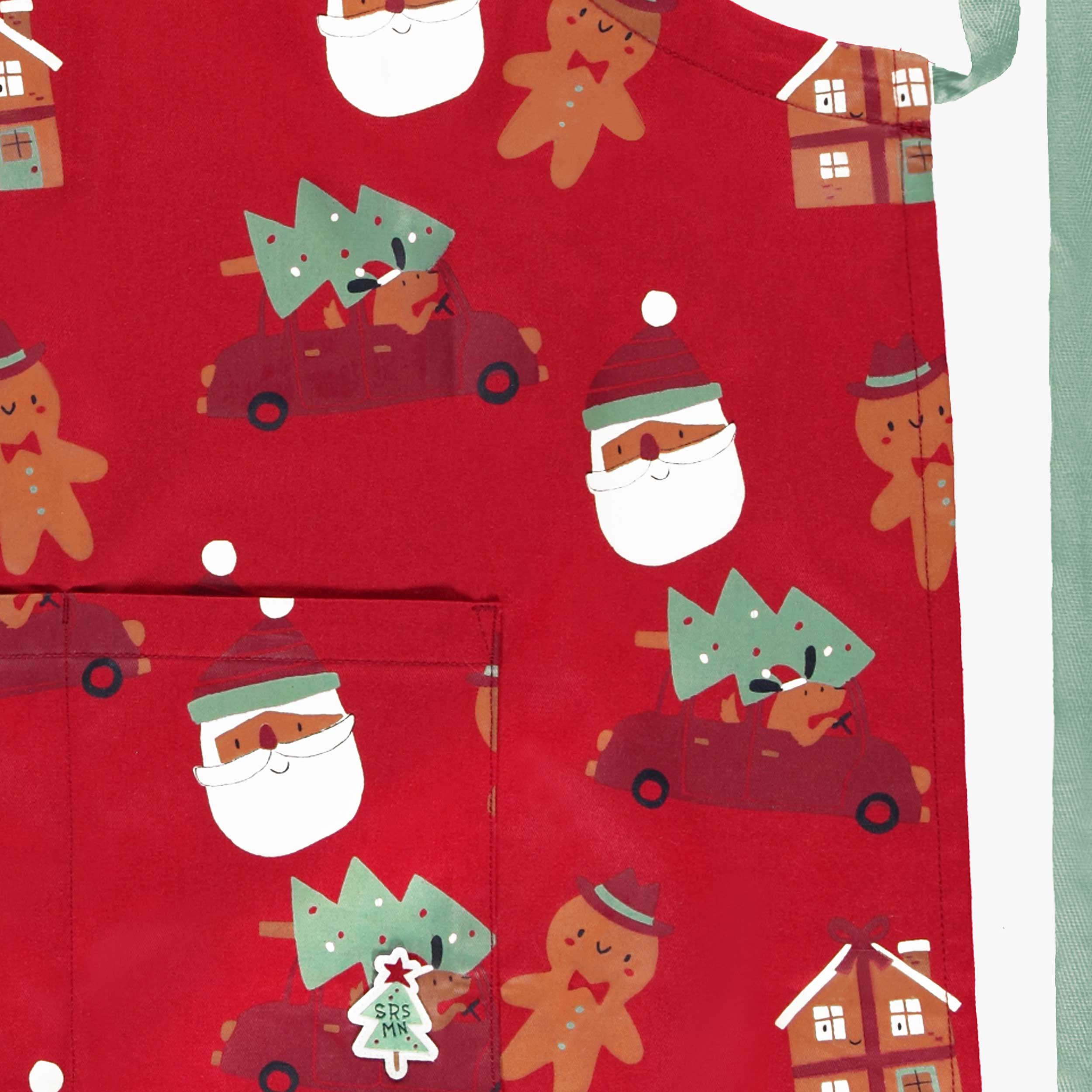 Zoom détails du tablier rouge à motifs des Fêtes, adulte