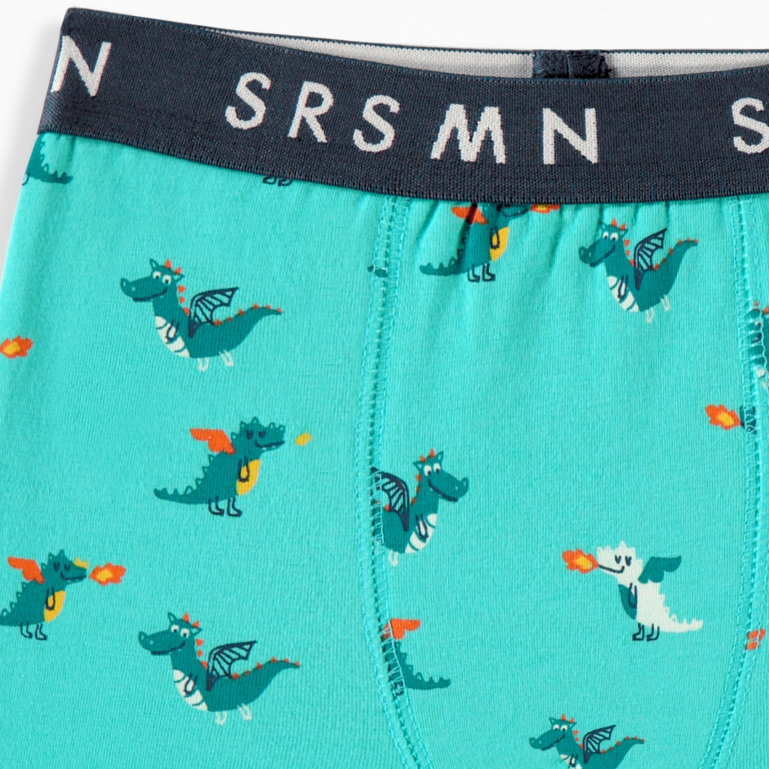 Zoom détails du boxer ajusté turquoise à imprimé de dragons, enfant