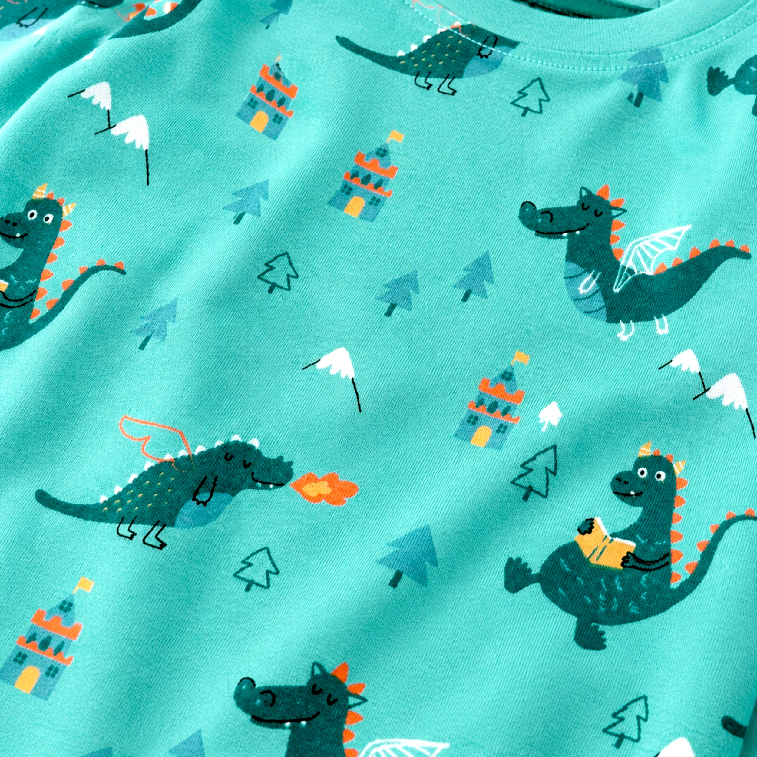 Zoom détails du pyjama deux pièces turquoise à imprimé de dragons, enfant