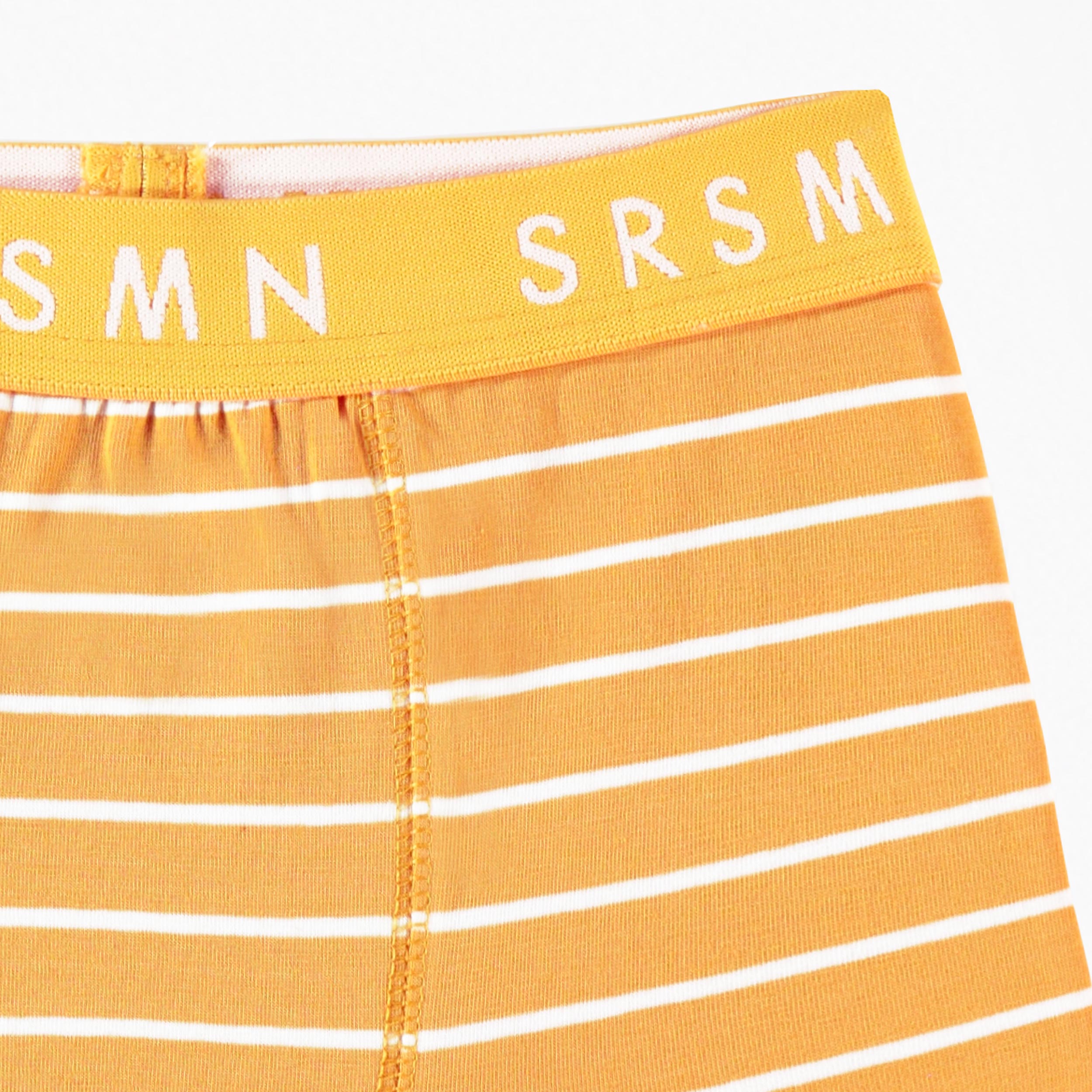 Zoom détails du boxer ajusté jaune à rayures, enfant