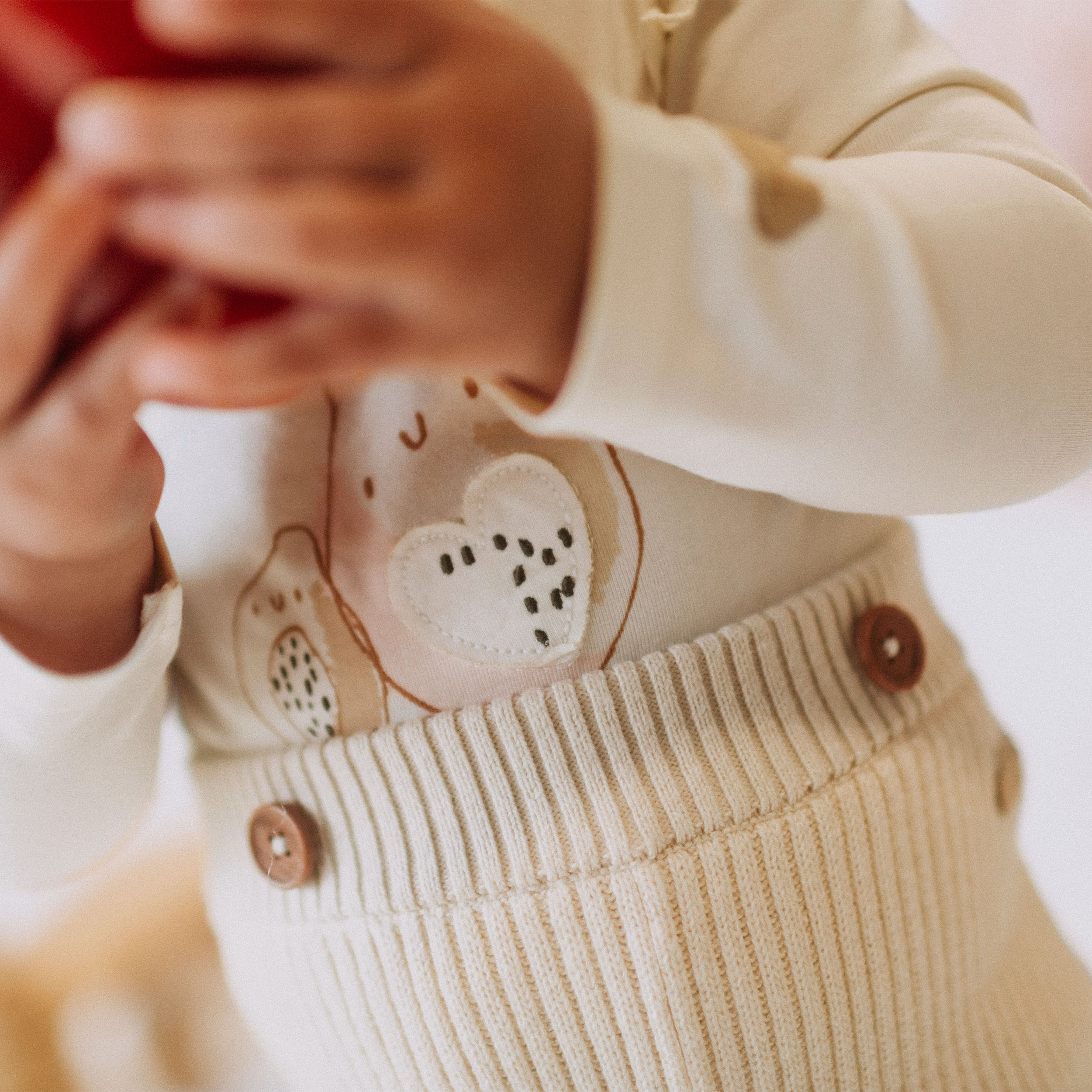 Cream knitted pants with straps in cashmere imitation, newborn