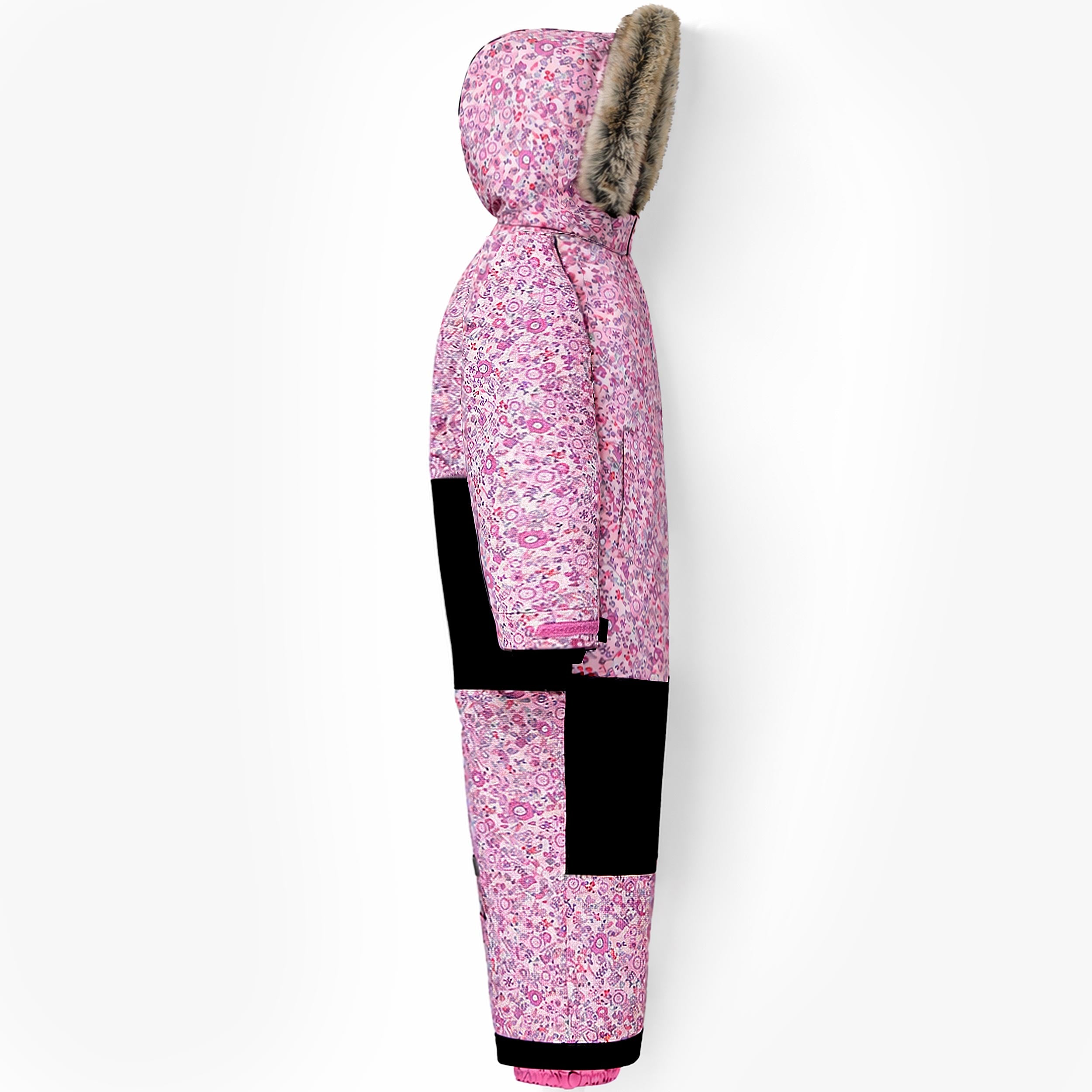 Vue de profil de la combinaison de neige enfant rose à imprimé floral avec capuche bordée de fausse fourrure et renforts de protection.