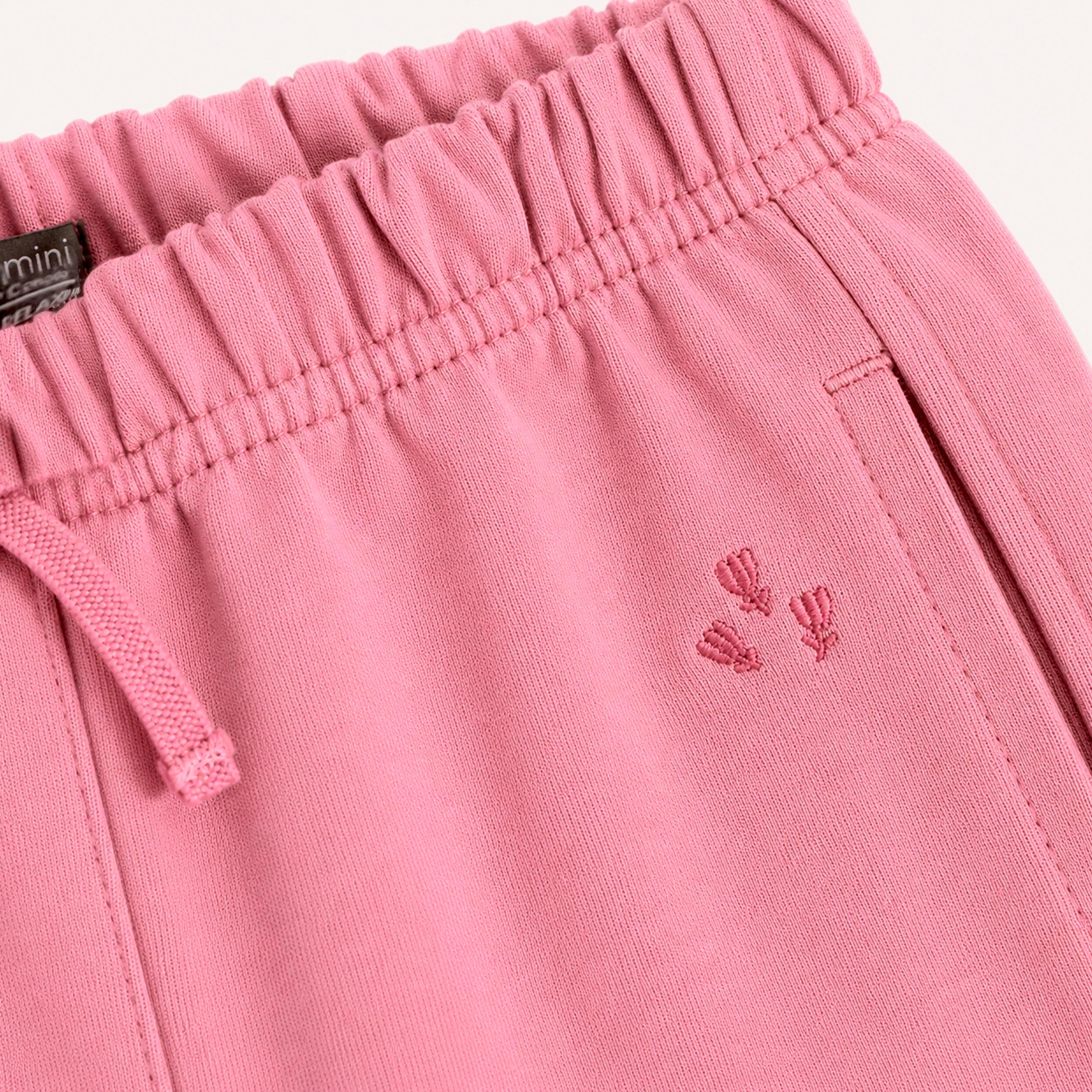 Détail du pantalon jogging rose bébé avec taille élastique et cordon ajustable - Souris Mini