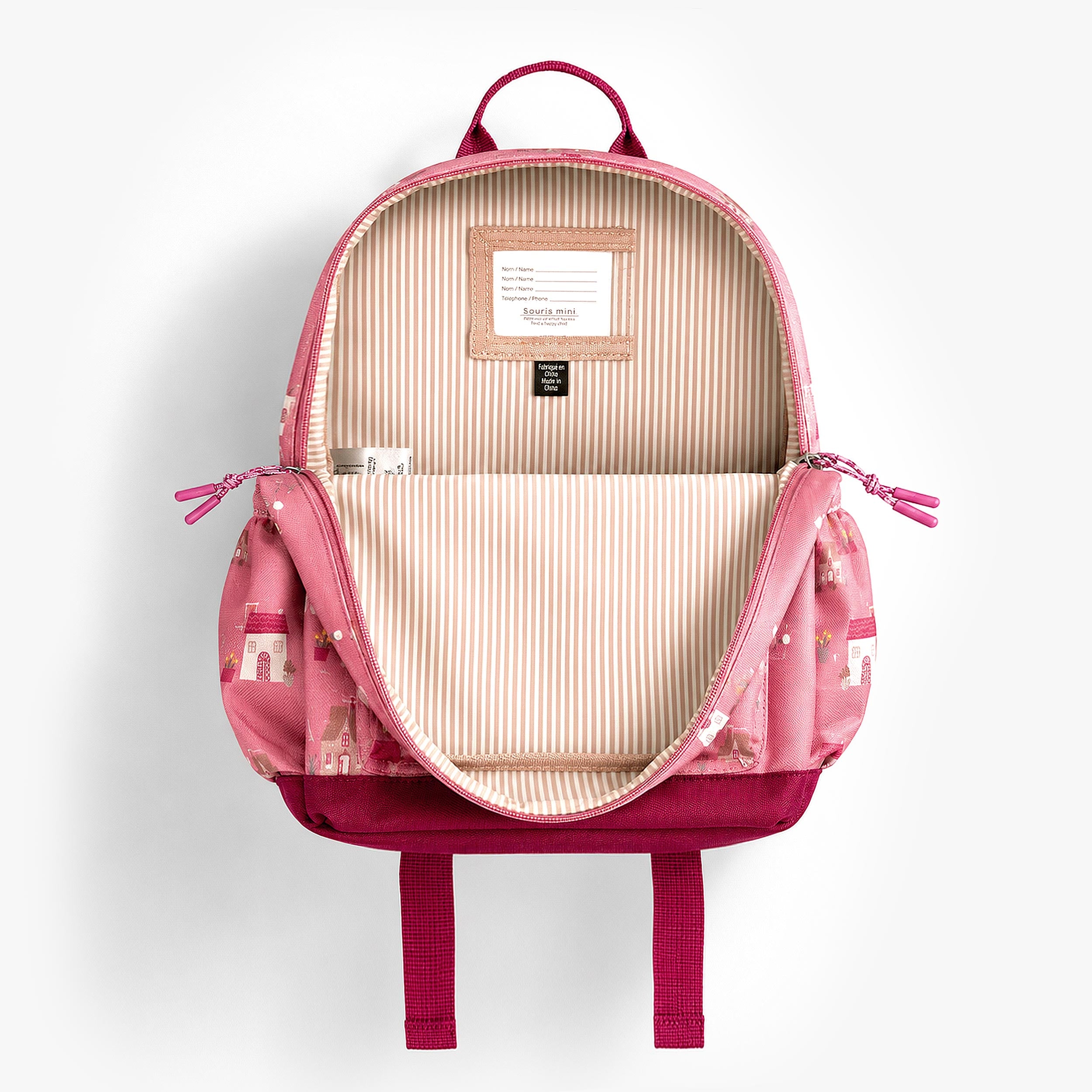 Intérieur du sac à dos enfant rose avec doublure rayée et compartiment principal spacieux