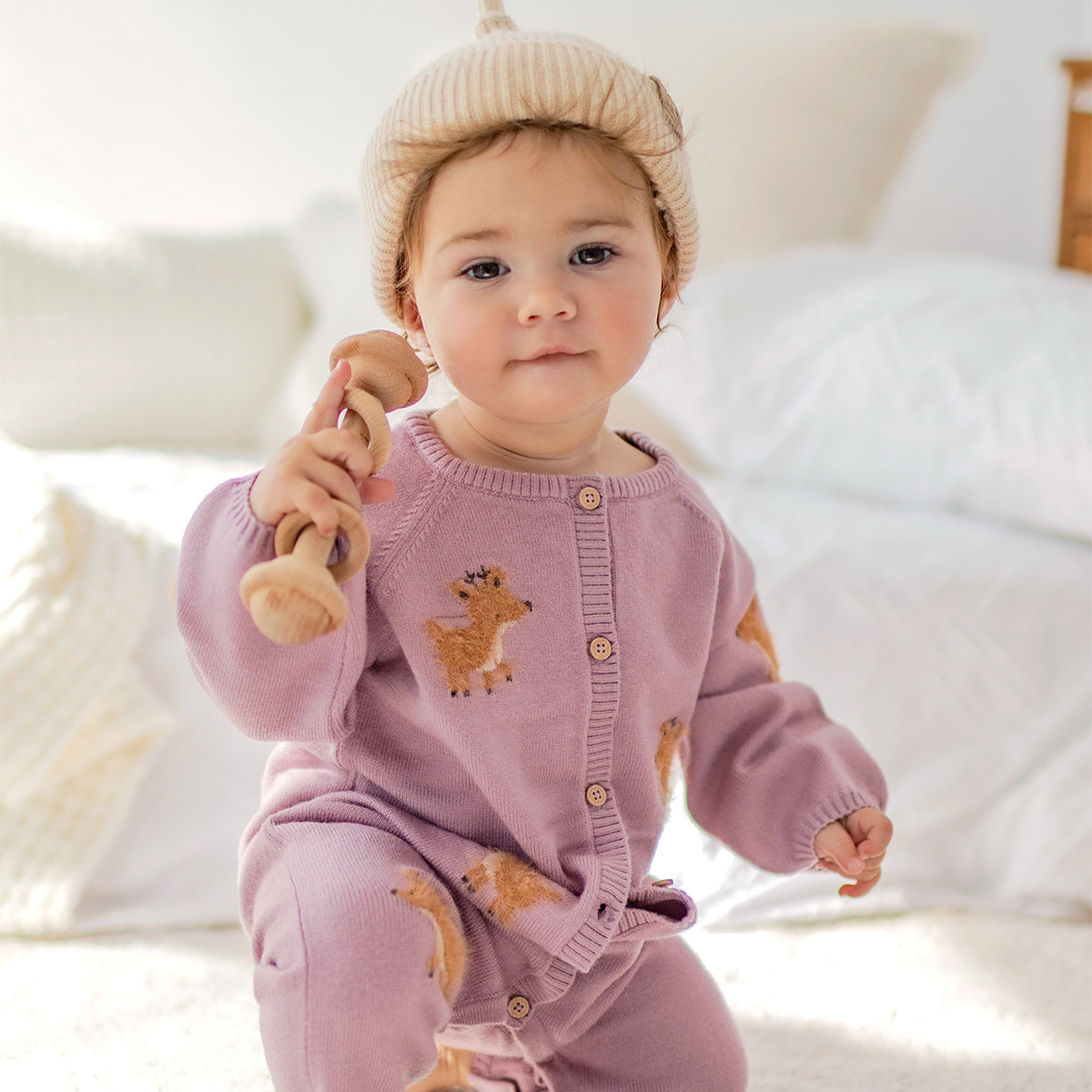Pink knit one-piece with fawn pattern, newborn
