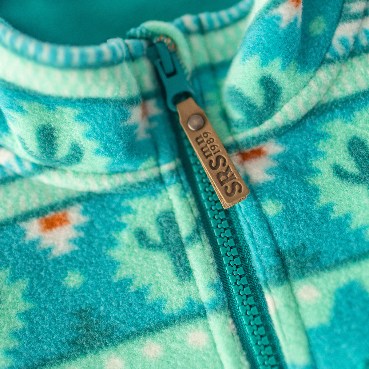 Veste en polar turquoise à motifs, adulte