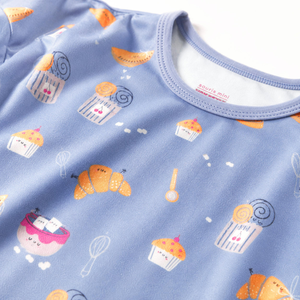 Blue two-piece pajama set with croissant print, child