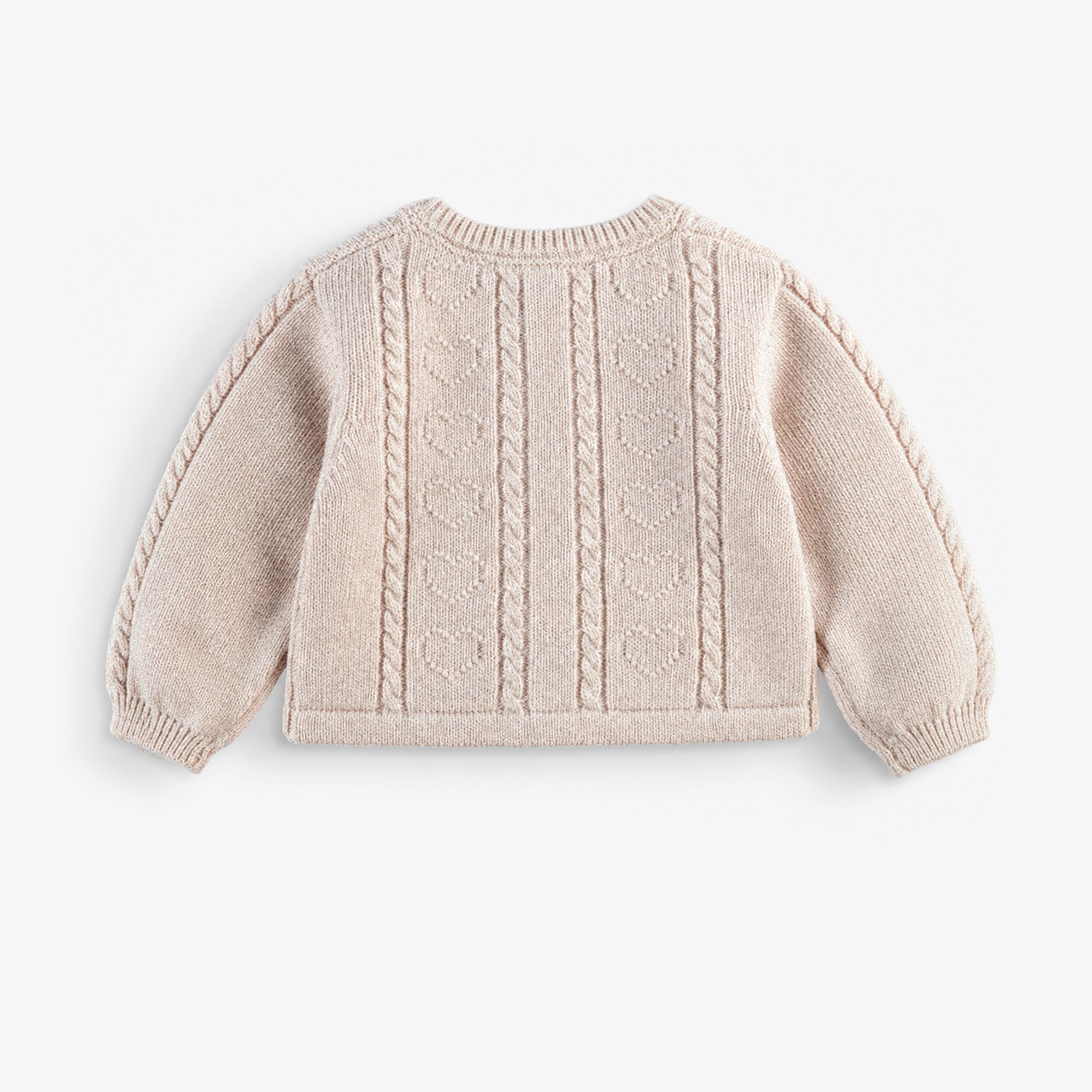 Veste de maille crème, naissance