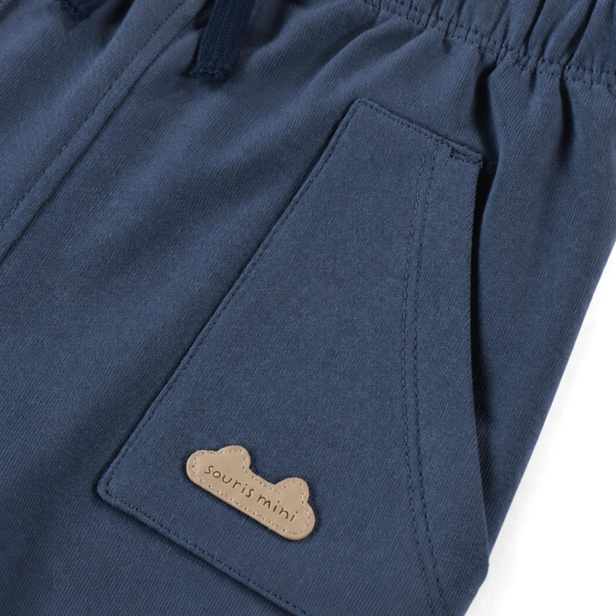 Pantalon bleu en coton français, naissance