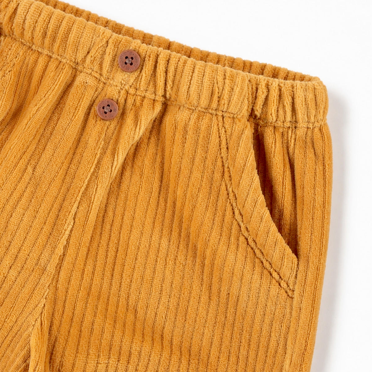 Pantalon jaune ocre en velours côtelé extensible, naissance