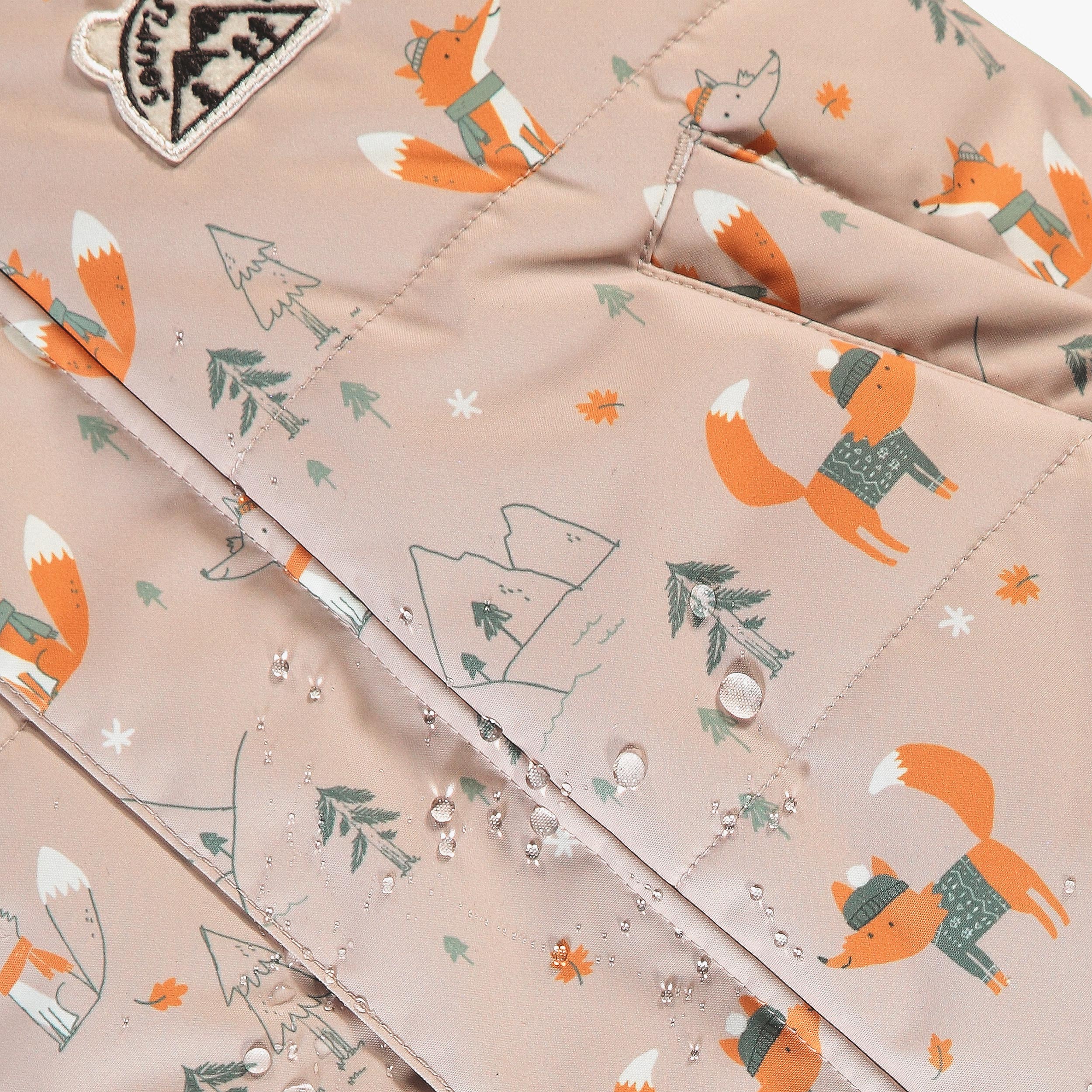 Habit de neige deux pièces beige et vert à imprimé, bébé