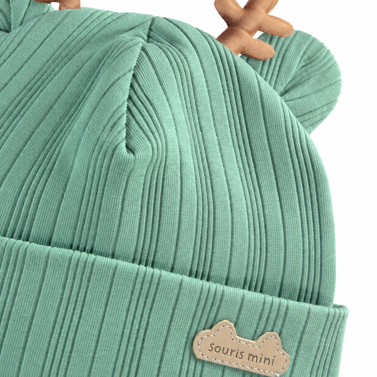 Bonnet vert à oreilles de renne, naissance