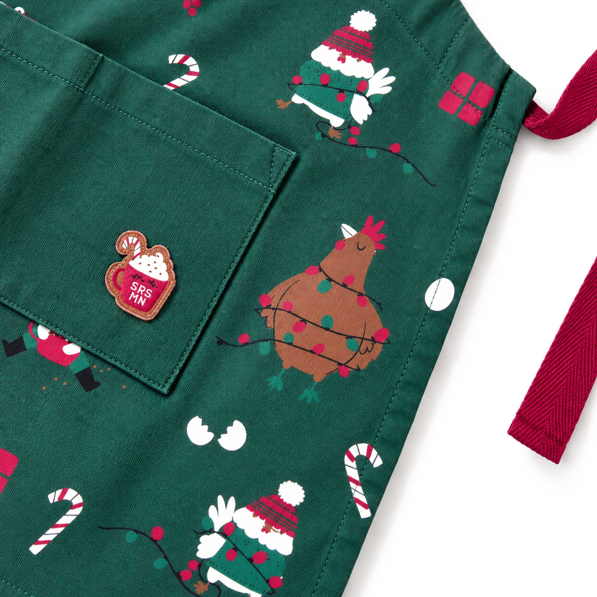 Green apron with holiday print, child