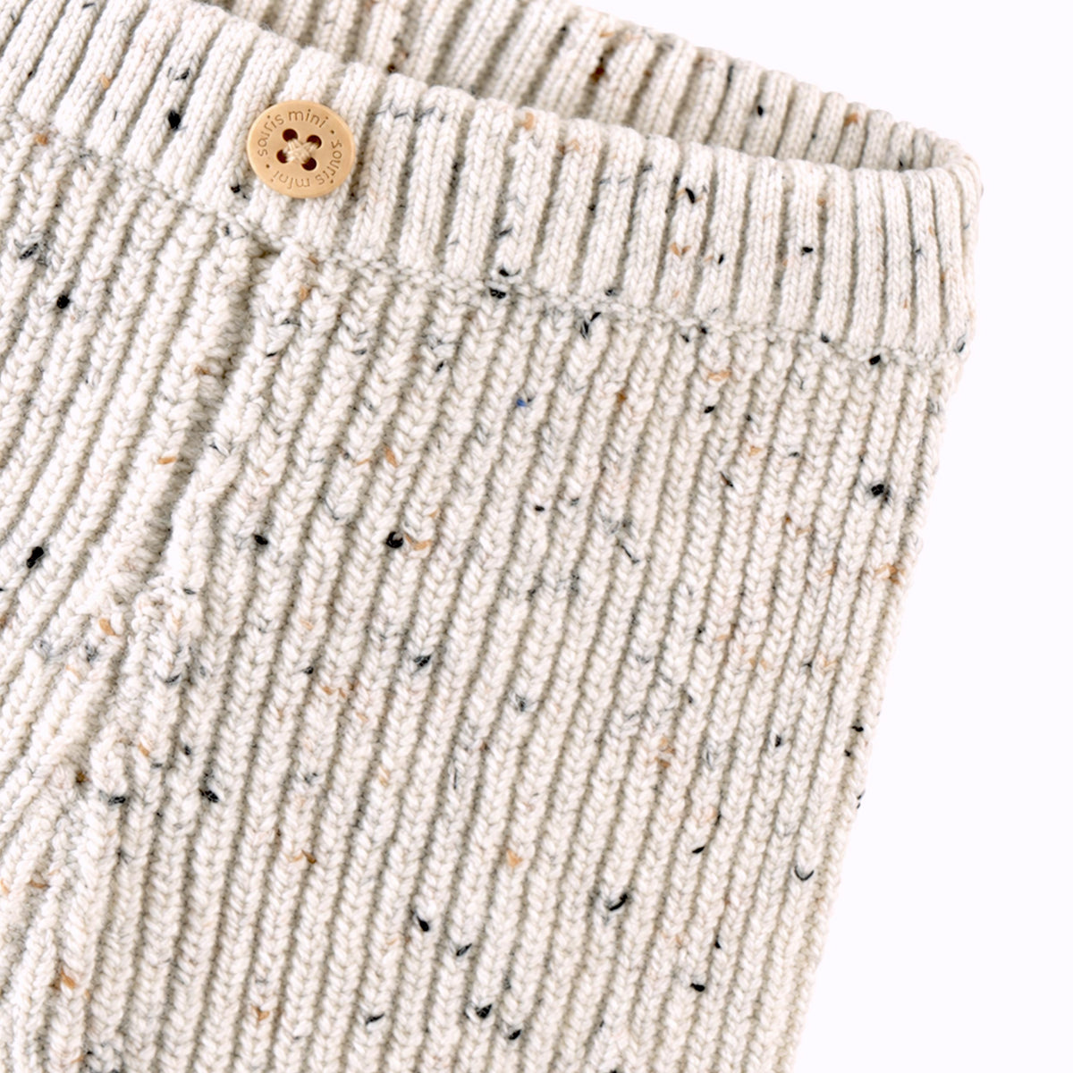 Pantalon crème en tricot moucheté, naissance