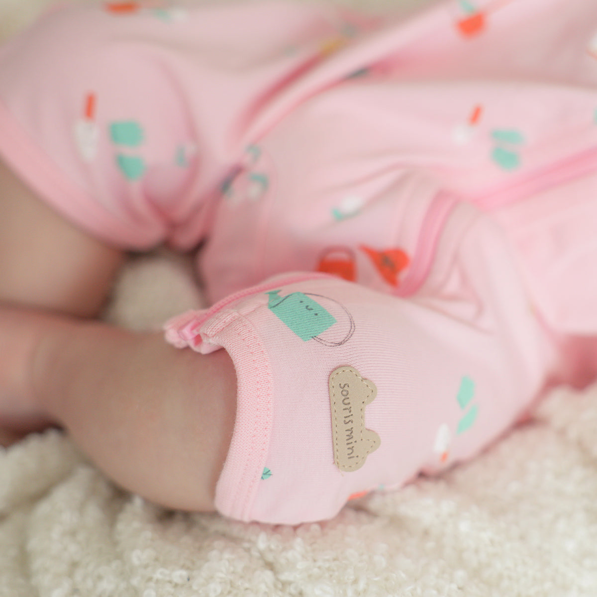 Pink patterned one-piece pajamas, newborn