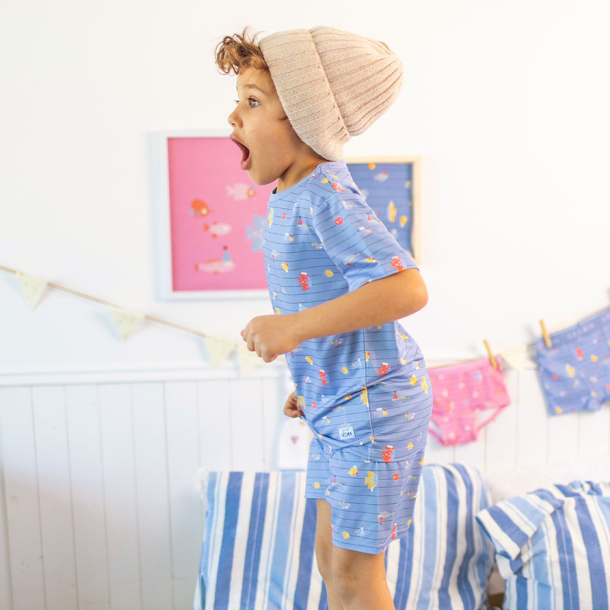 Blue two-piece pajamas with stripes and fish patterns, child