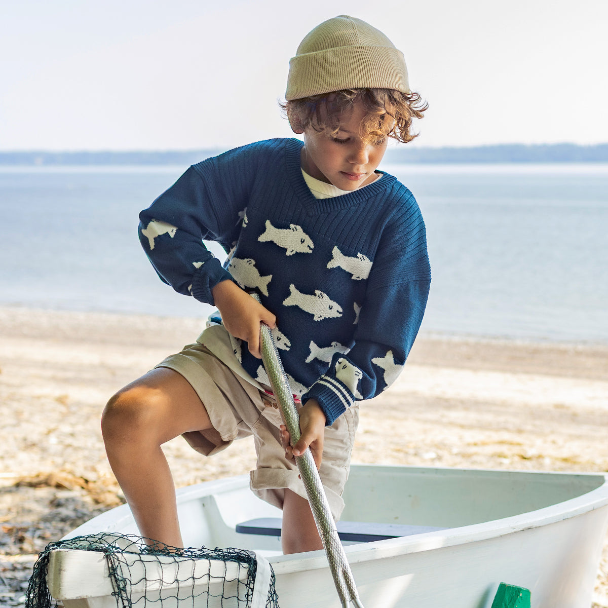 Blue knit sweater with fish, child