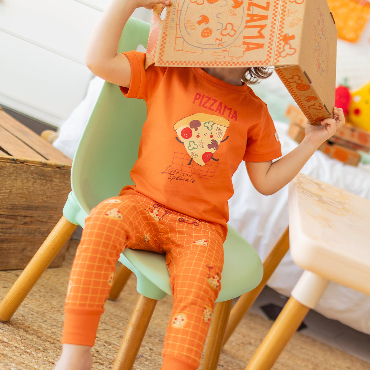 Orange two-piece pajamas with pizza patterns, baby