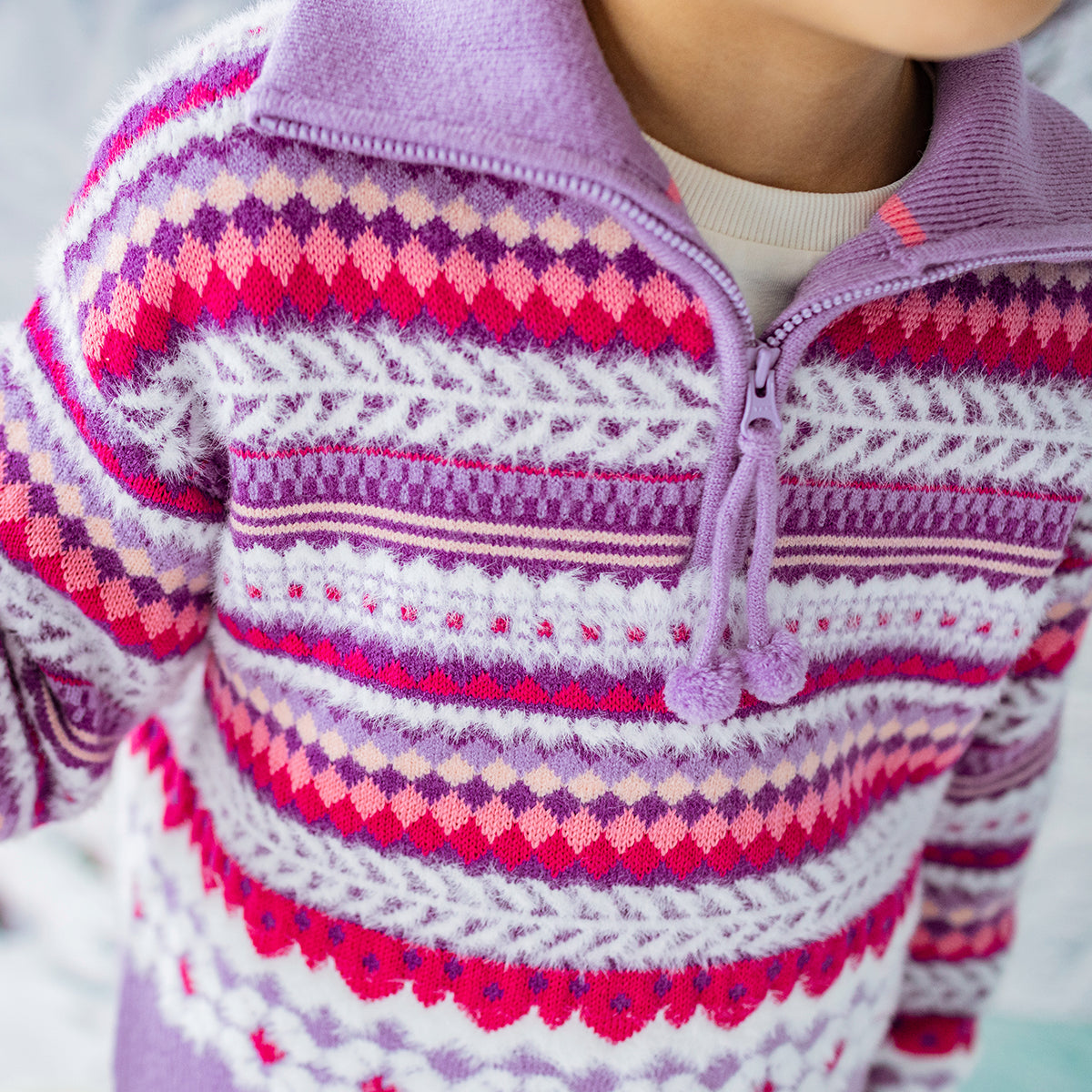 Purple knitted sweater with patterns, child