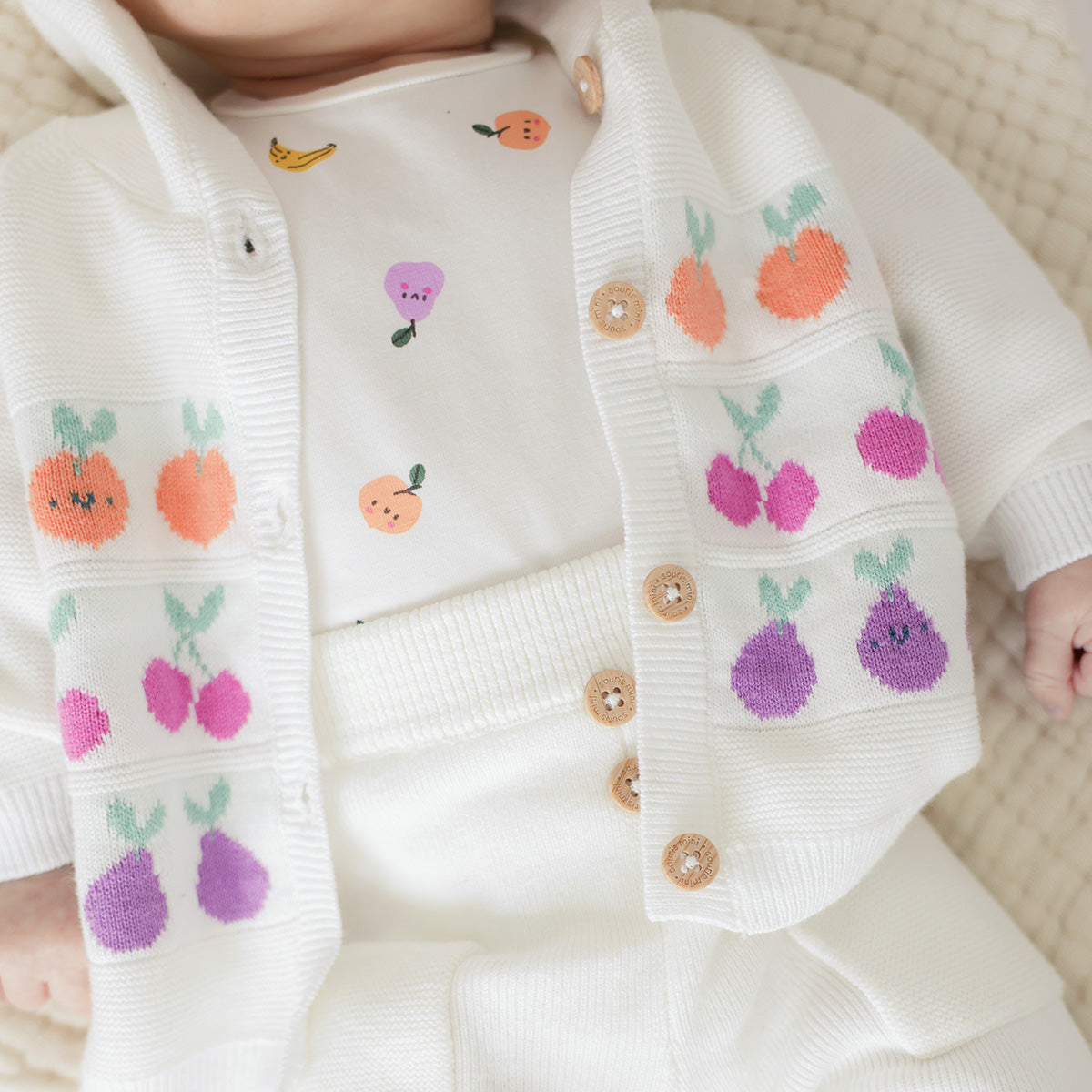 Cream knit cardigan with jacquard patterns, newborn
