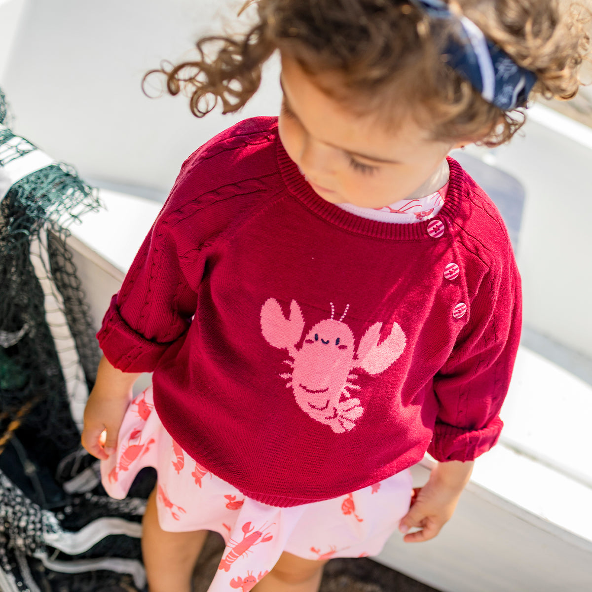 Chandail rouge en tricot avec homard, bébé