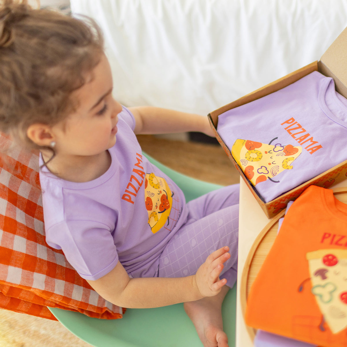 Two-piece purple pajamas with pizza patterns, baby