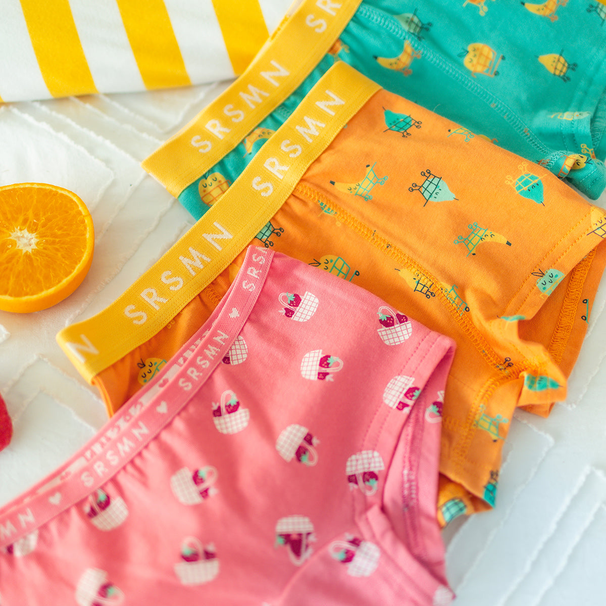 Orange boxer shorts with fruit patterns, child