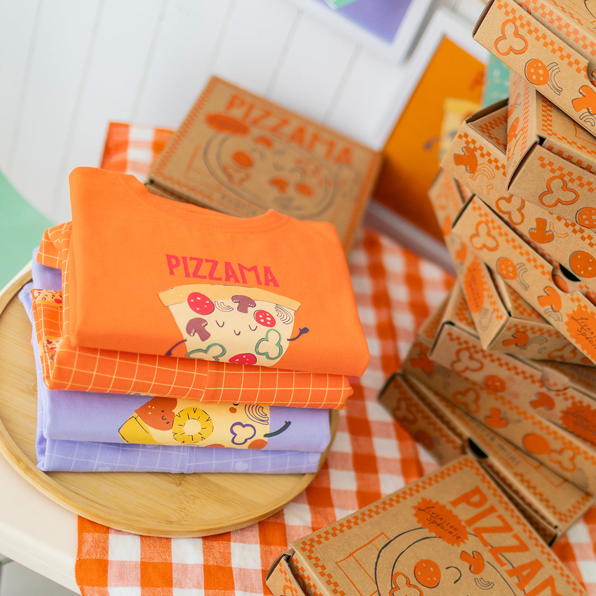 Orange two-piece pajamas with pizza patterns, baby