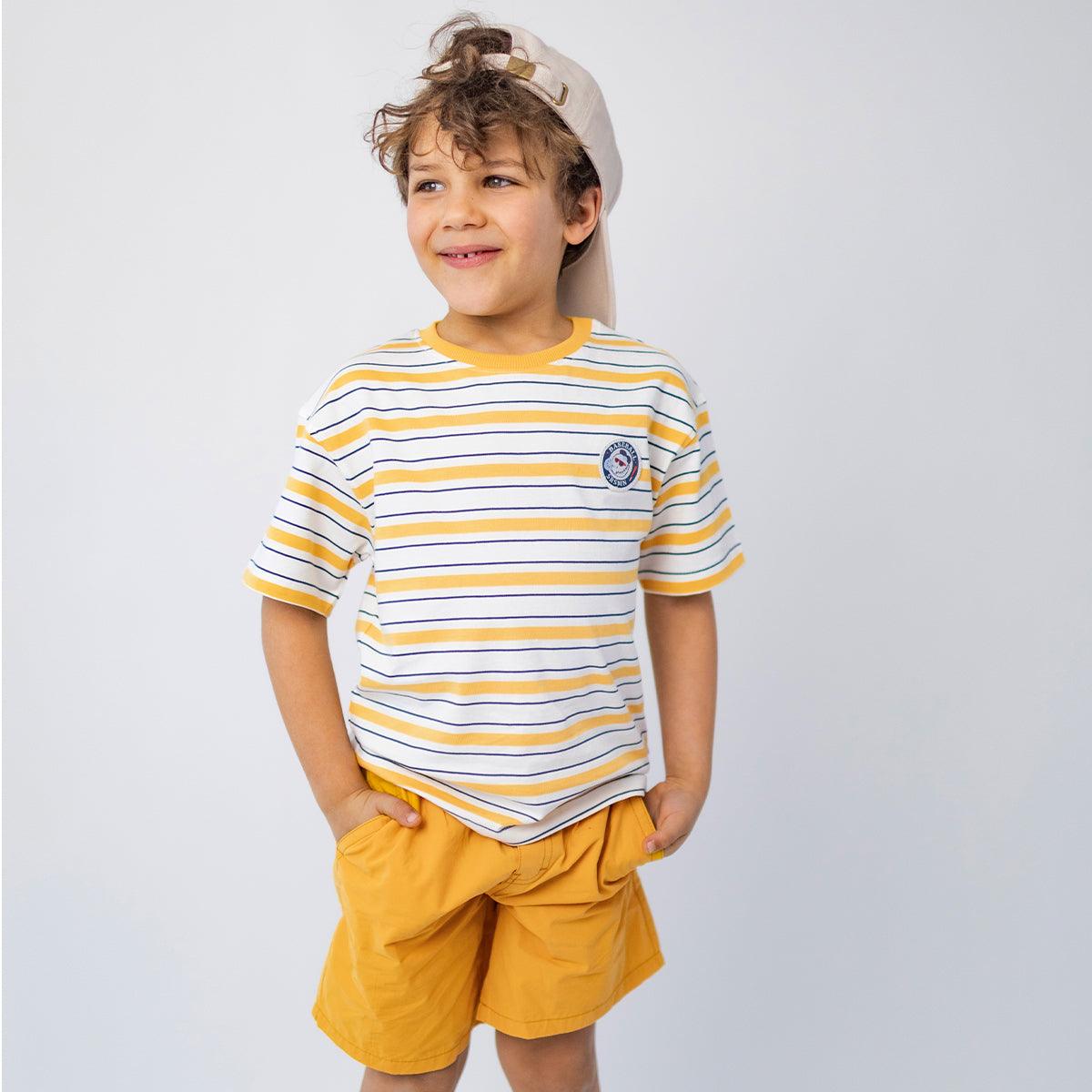 White T-shirt with yellow and navy blue stripes, child