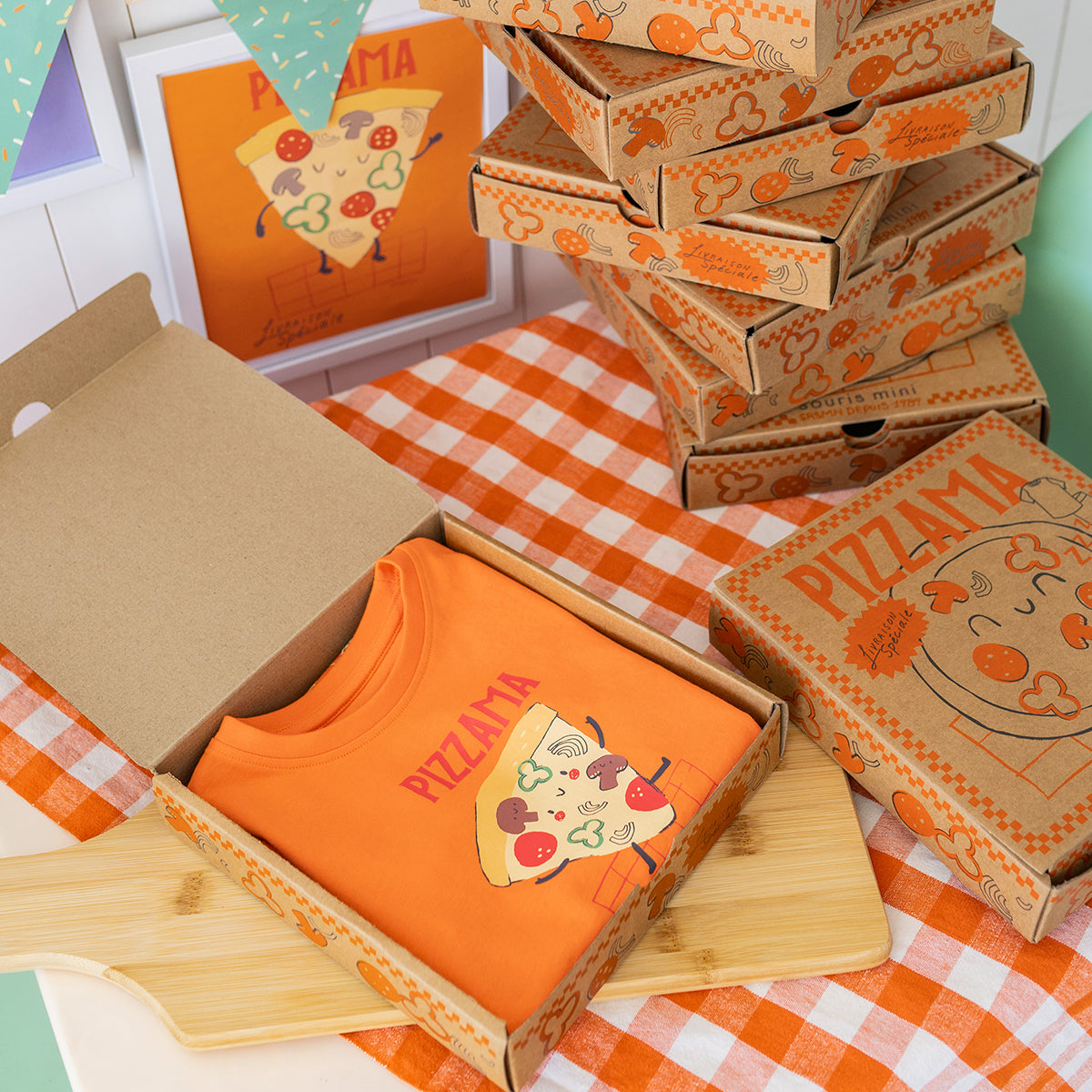Orange two-piece pajamas with pizza patterns, child
