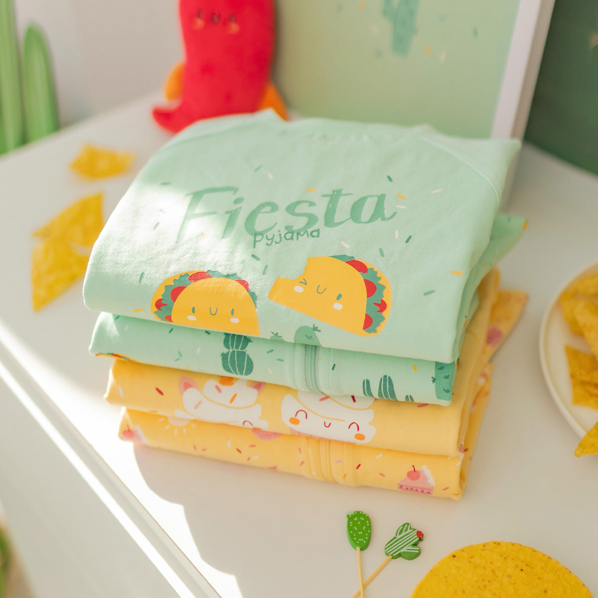 Green two-piece pajama set with fiesta pattern, child