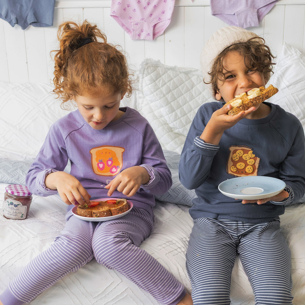 Blue two-piece pajamas with a toast illustration, child