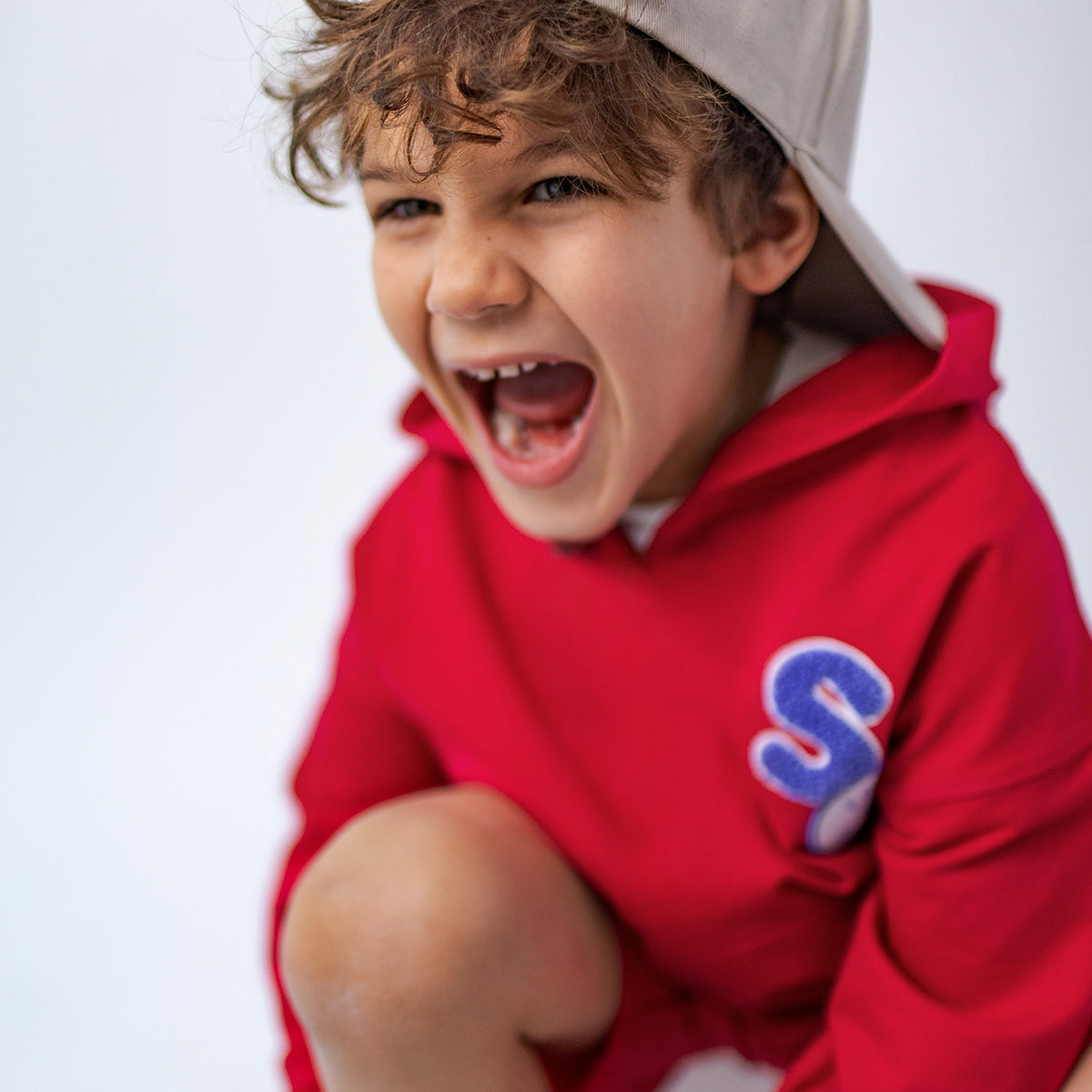 Red hooded sweatshirt, child
