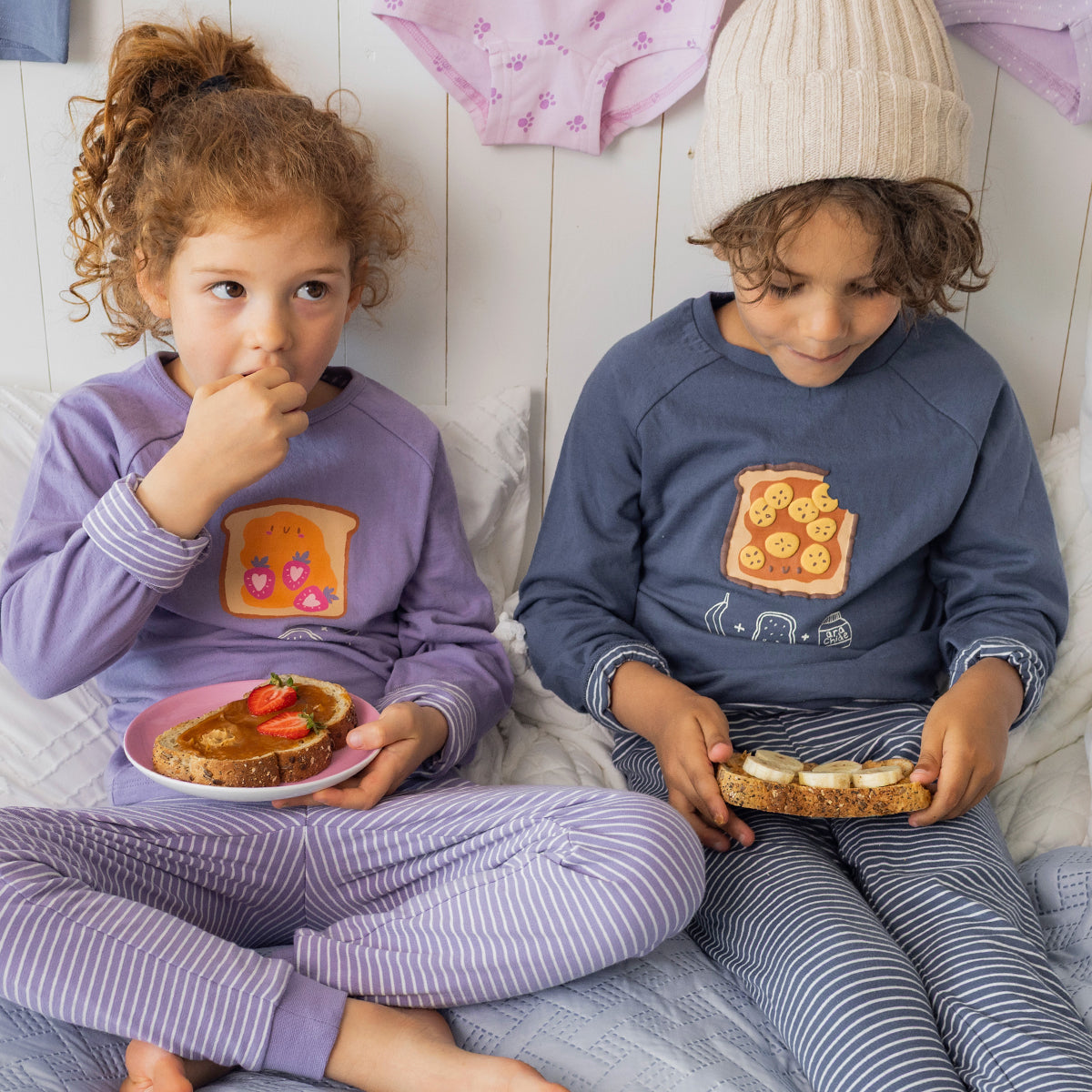 Two-piece mauve pajamas with a toast illustration, child