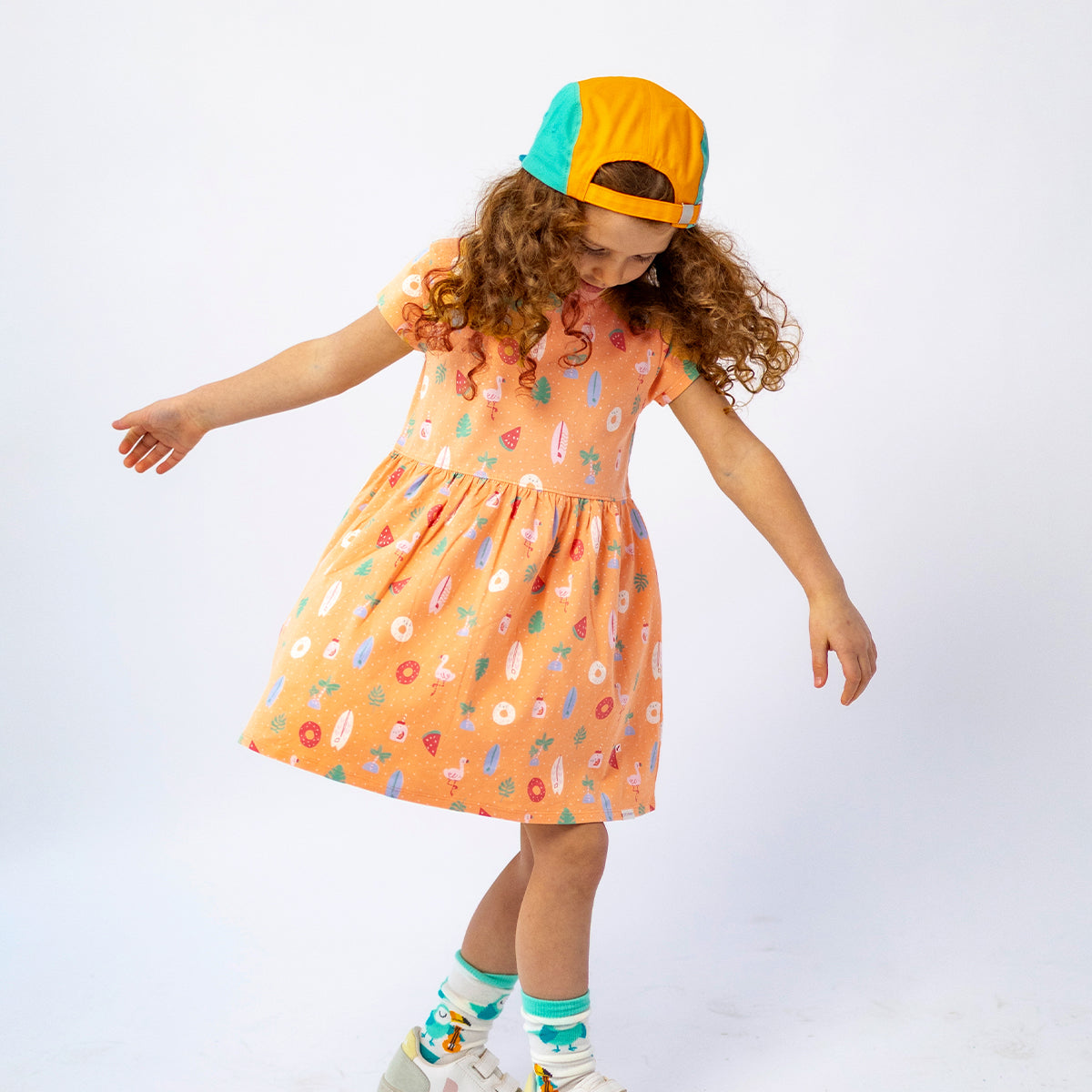 Orange patterned dress, child